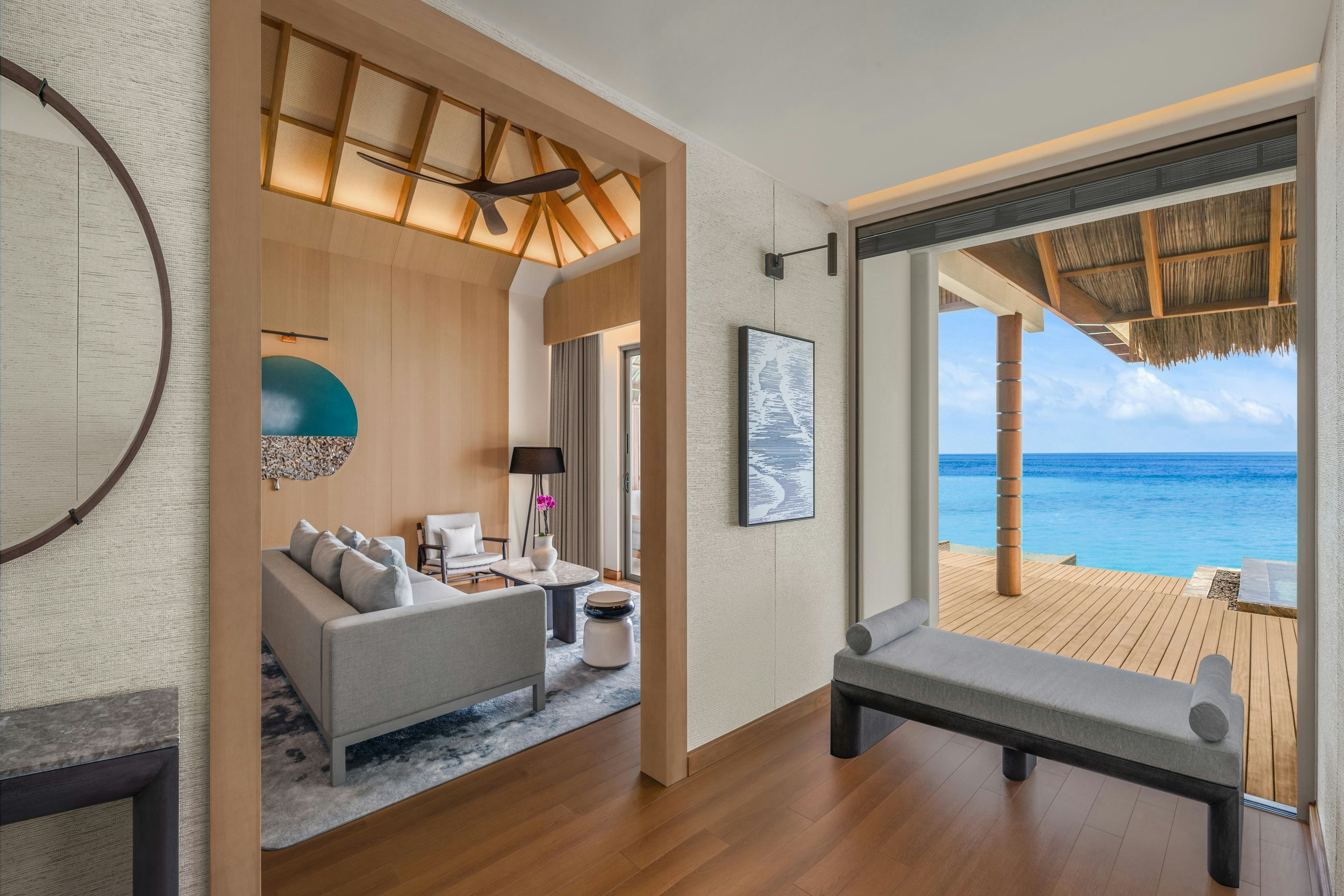 JW Marriott Maldives Kaafu Atoll Island Resort-guestroom-One Bedroom Overwater Villa - Living Room.jpg