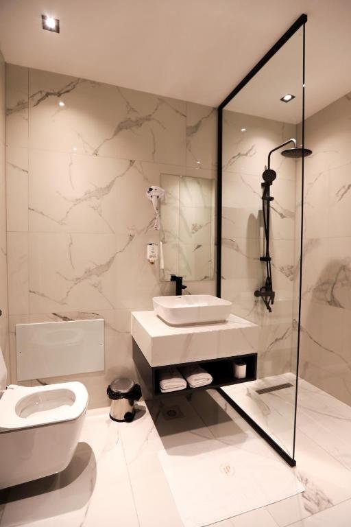 PLAZA BOUTIQUE HOTEL PRISHTINA-guestroom-BATHROOM.jpg
