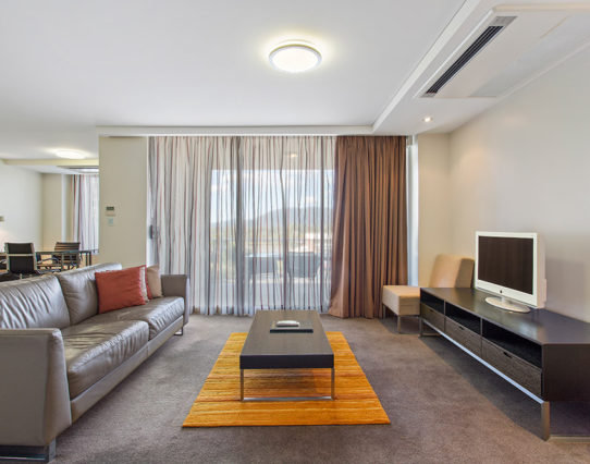 CBD Executive Apartments-guestroom-One Bedroom Apartment Living Room.jpg