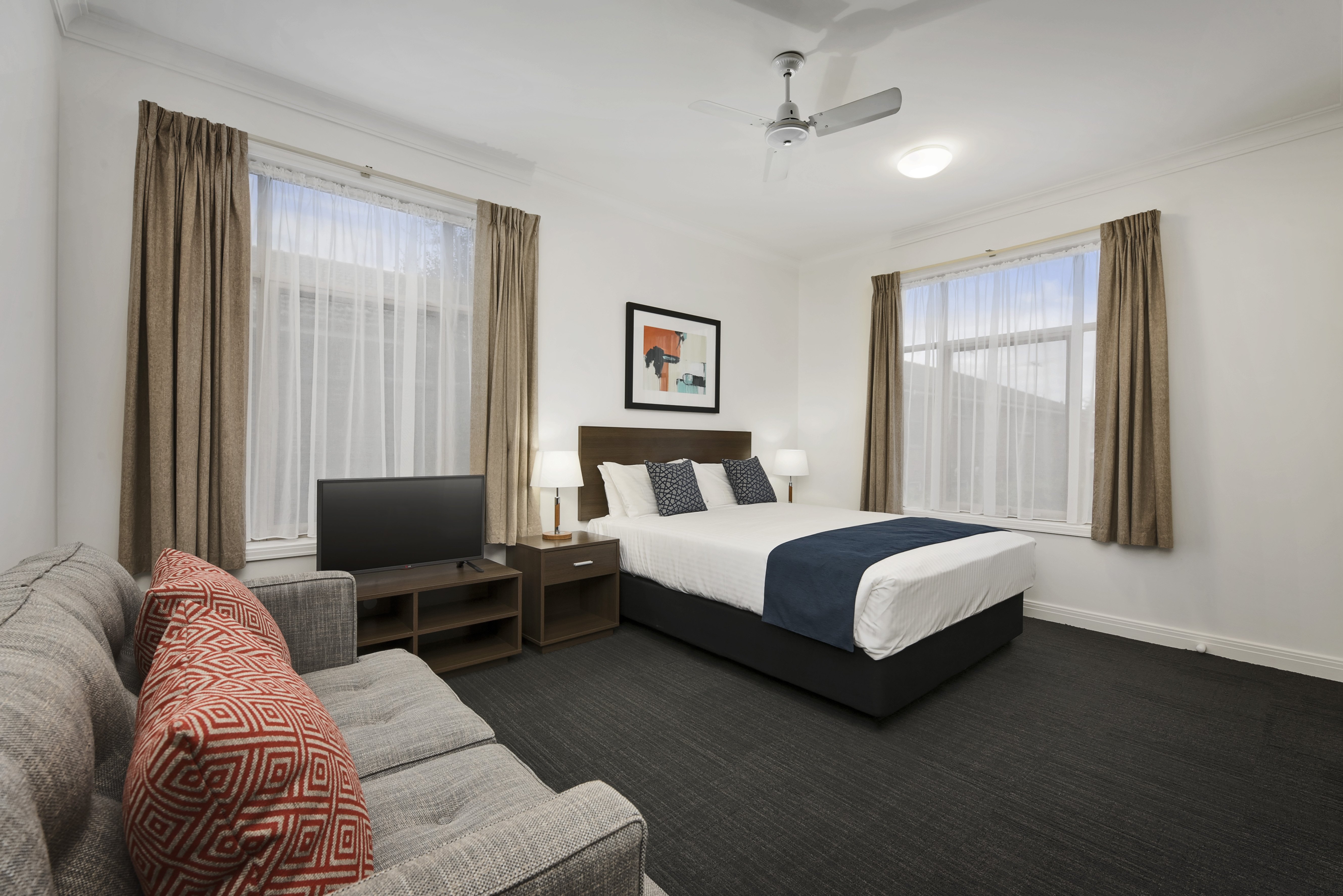 QUEST DANDENONG-guestroom-Studio Apartment Living Area And Bed.jpg