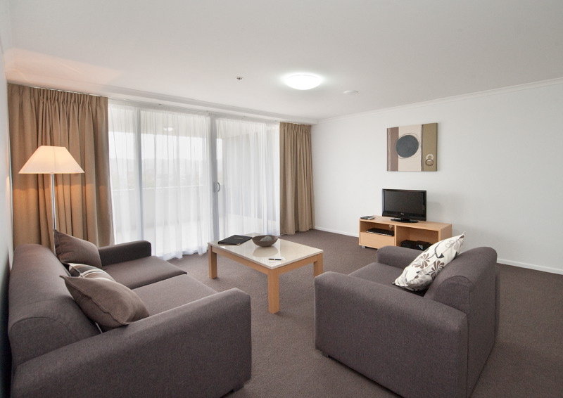 The Edge Apartment Hotel-guestroom-One or Two Bedroom Apartment Living Room.jpg
