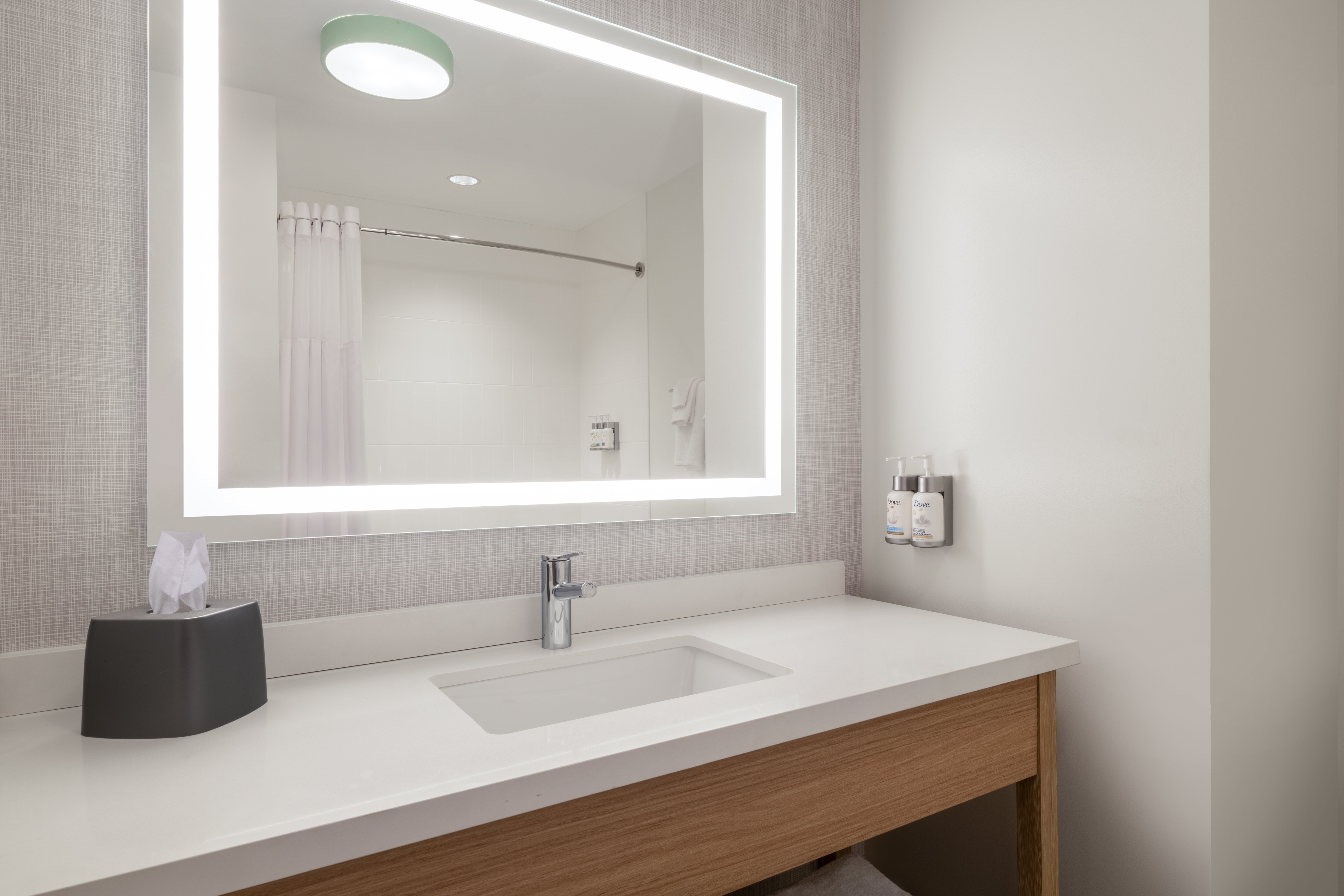 GARNER HOTEL GONZALES BY IHG-guestroom-Our guest bathrooms have plenty of counter space to get ready..jpg