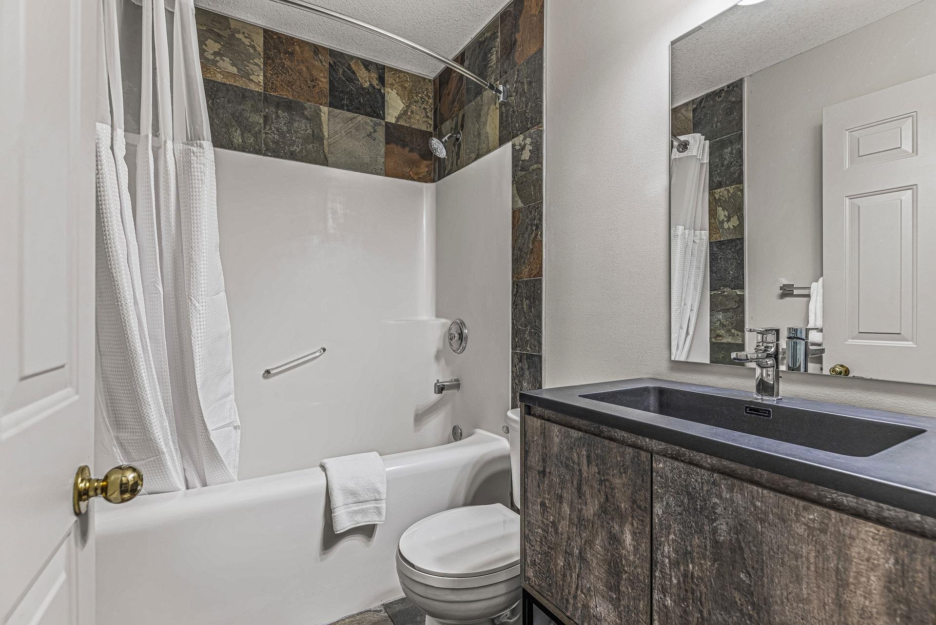 Canmore Rocky Mountain Inn-guestroom-Economy Two Queen Room Bathroom.jpg
