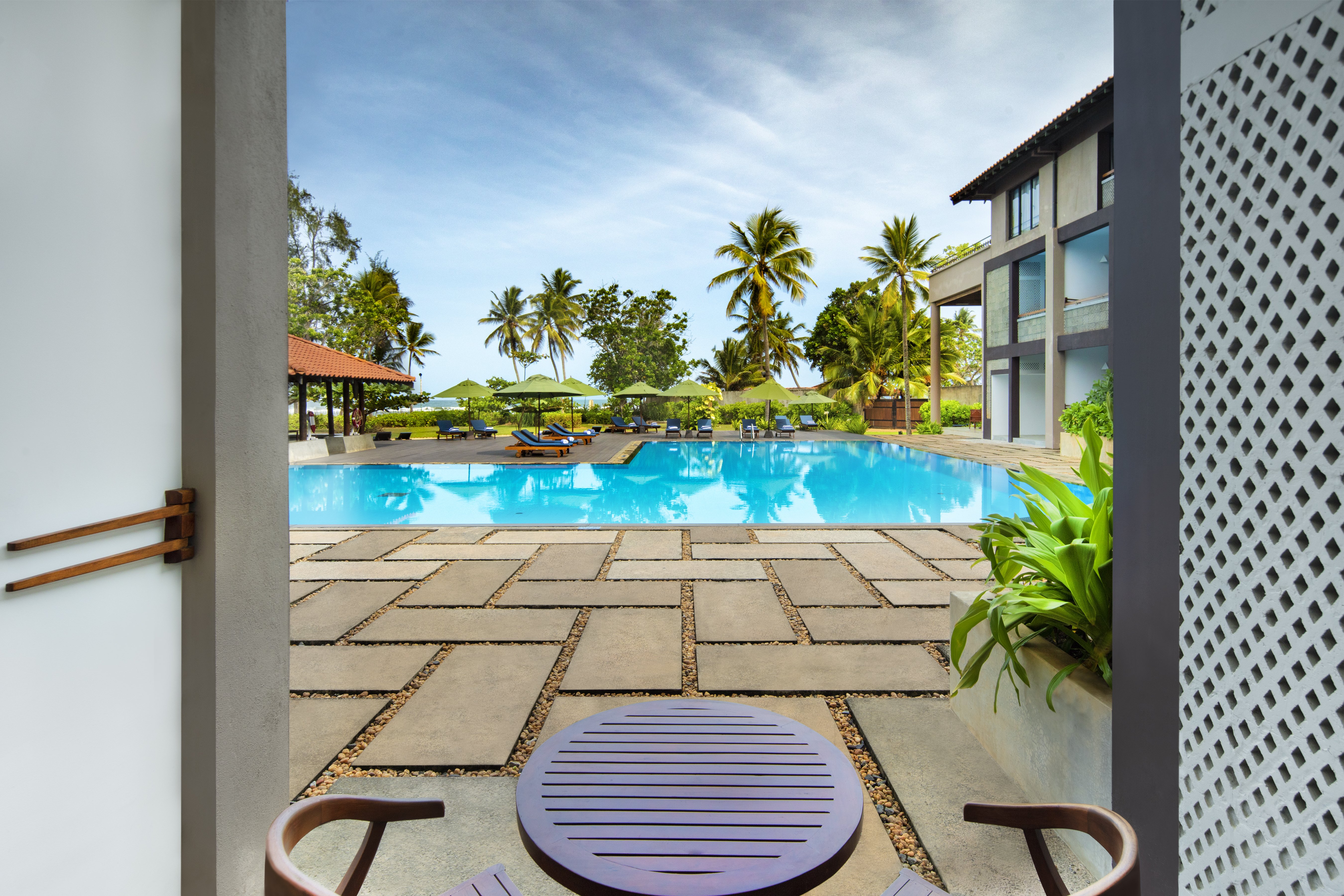 CINNAMON BEY BERUWALA-guestroom-Deluxe room Pool Terrace with Chairs.jpg
