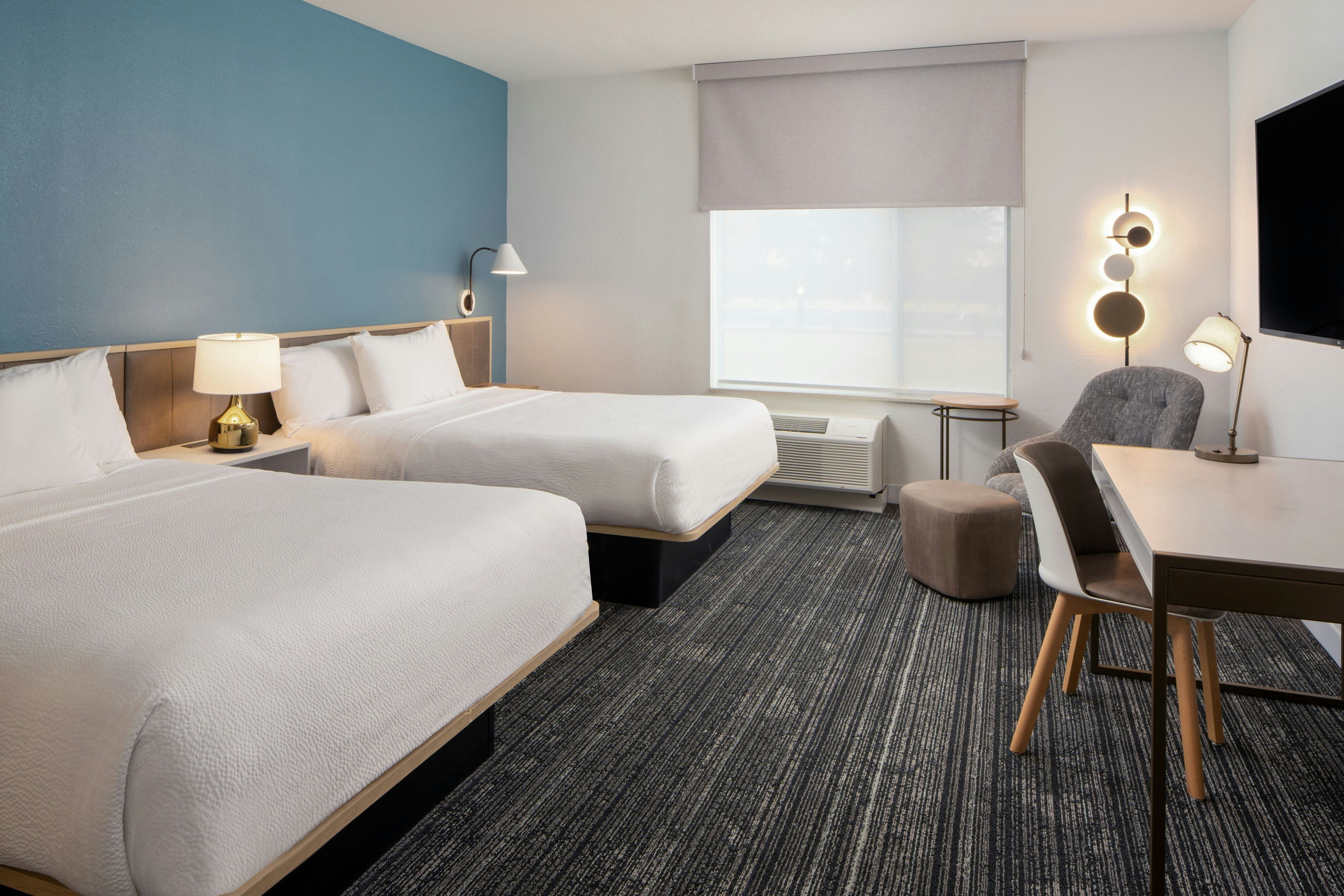 TownePlace Suites by Marriott Memphis Cordova-guestroom-Queen/Queen Studio Bedroom and Seating Area.jpg