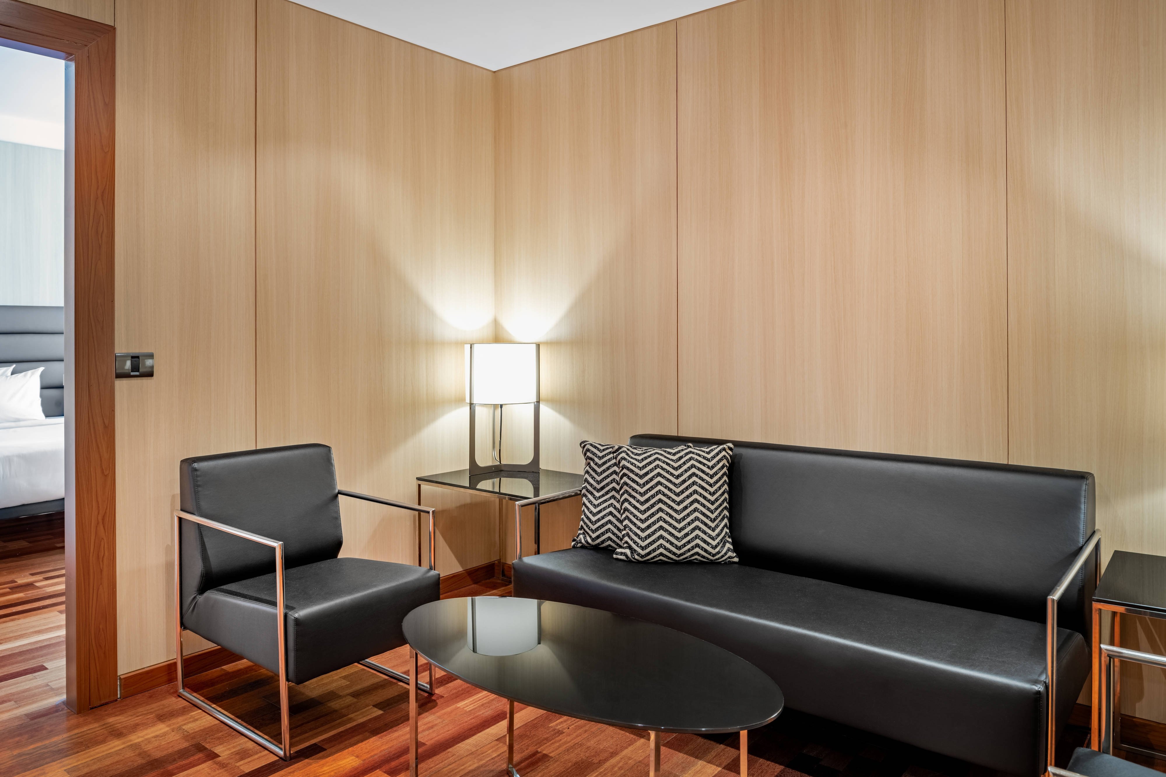AC Hotels by Marriott Hotel Badajoz-guestroom-Junior Suite - Living Room.jpg