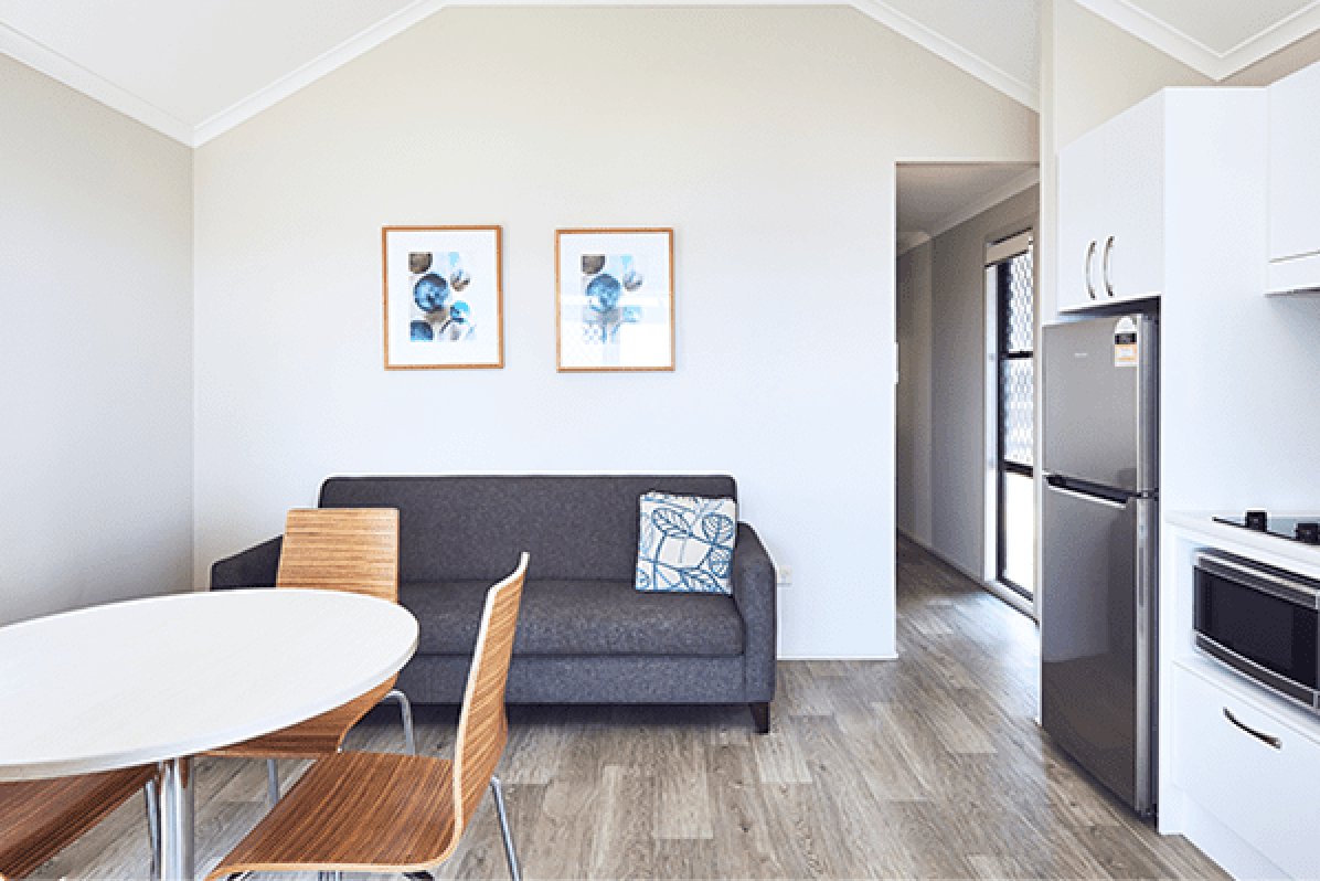 NRMA PORT MACQUARIE BREAKWALL-guestroom-Bayside Cabin Living Area.jpg