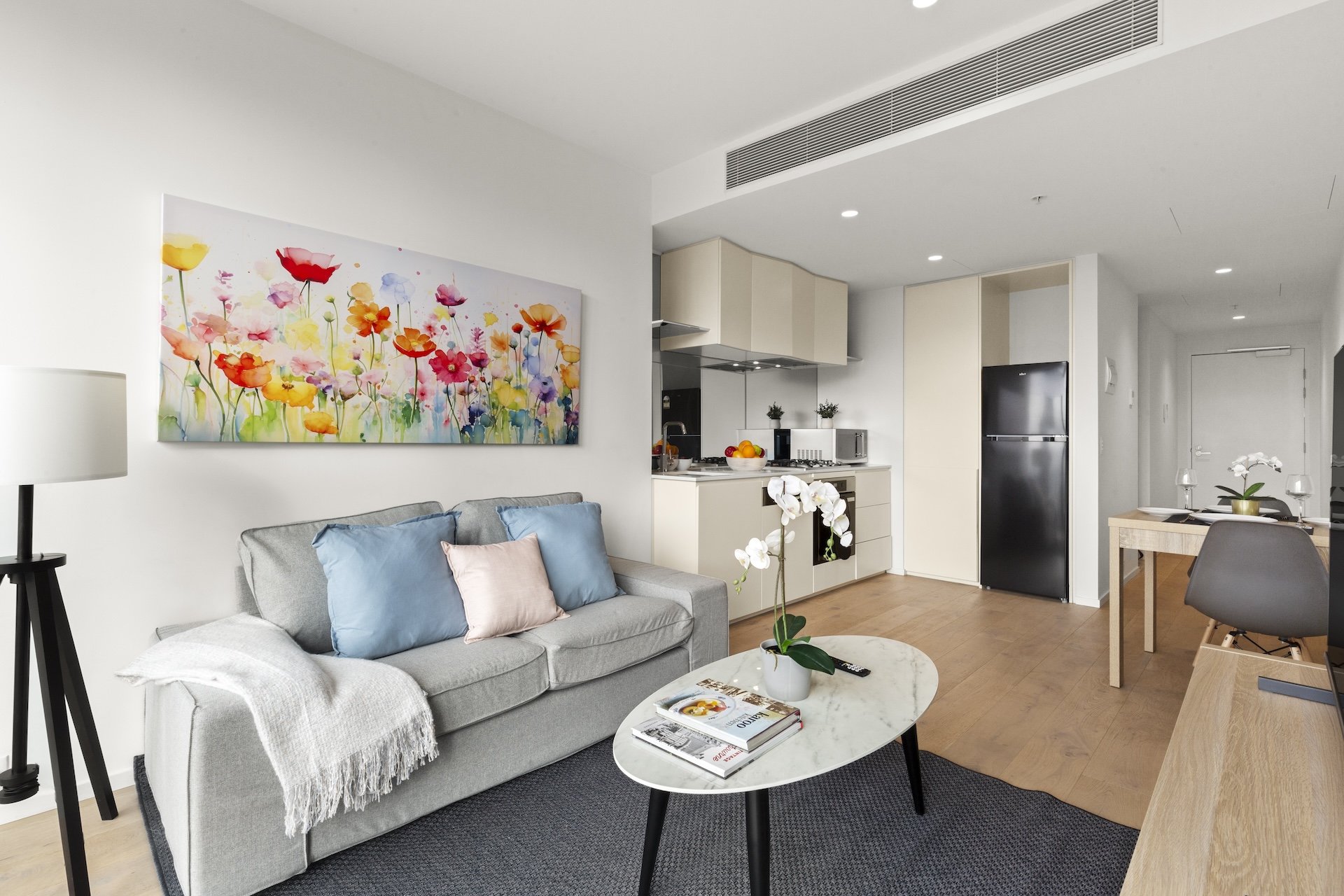 ASTRA APARTMENTS MELBOURNE SQU-guestroom-One Bedroom Apartment Living Room.jpg