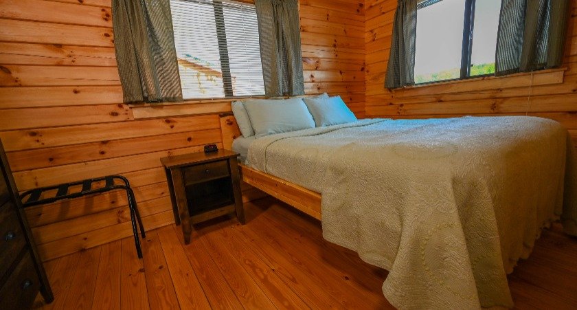 Wilderness Presidential Resort-guestroom-Hot Tub Cottage Bedroom.jpg