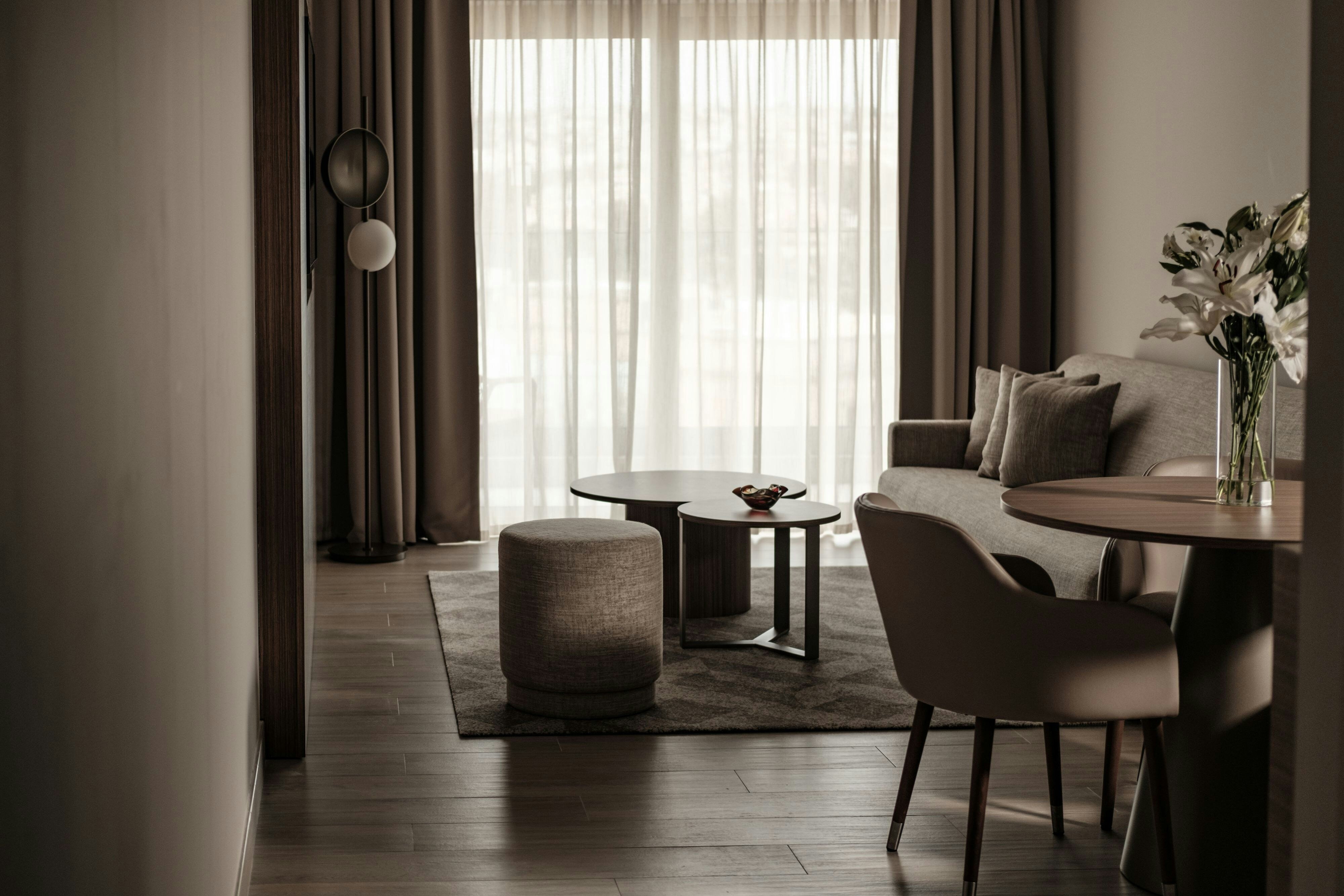 AC Hotel by Marriott St Julians-guestroom-King Suite Dining Area.jpg