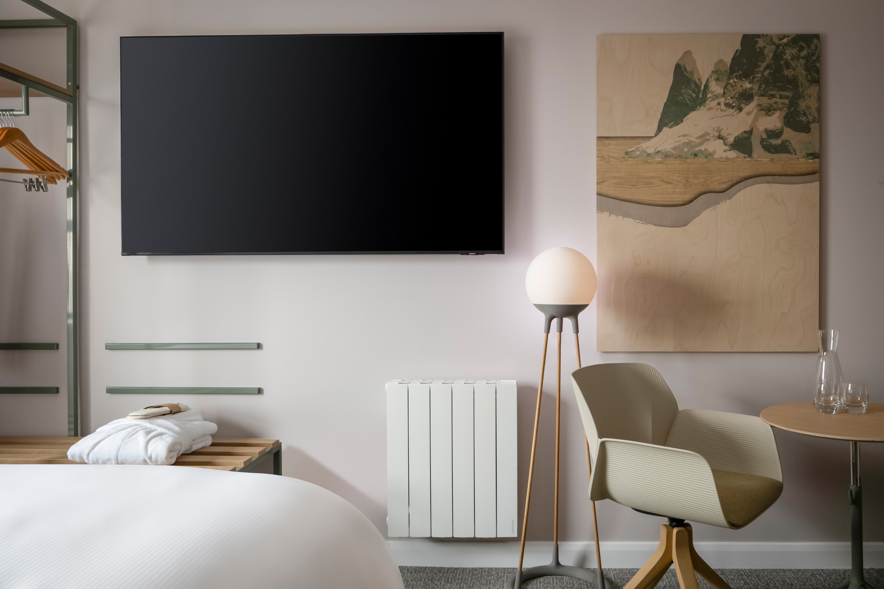 VOCO ZEAL EXETER SCIENCE PARK BY IH-guestroom-Premium room with a stylish lamp, elegant artwork, and large TV.jpg