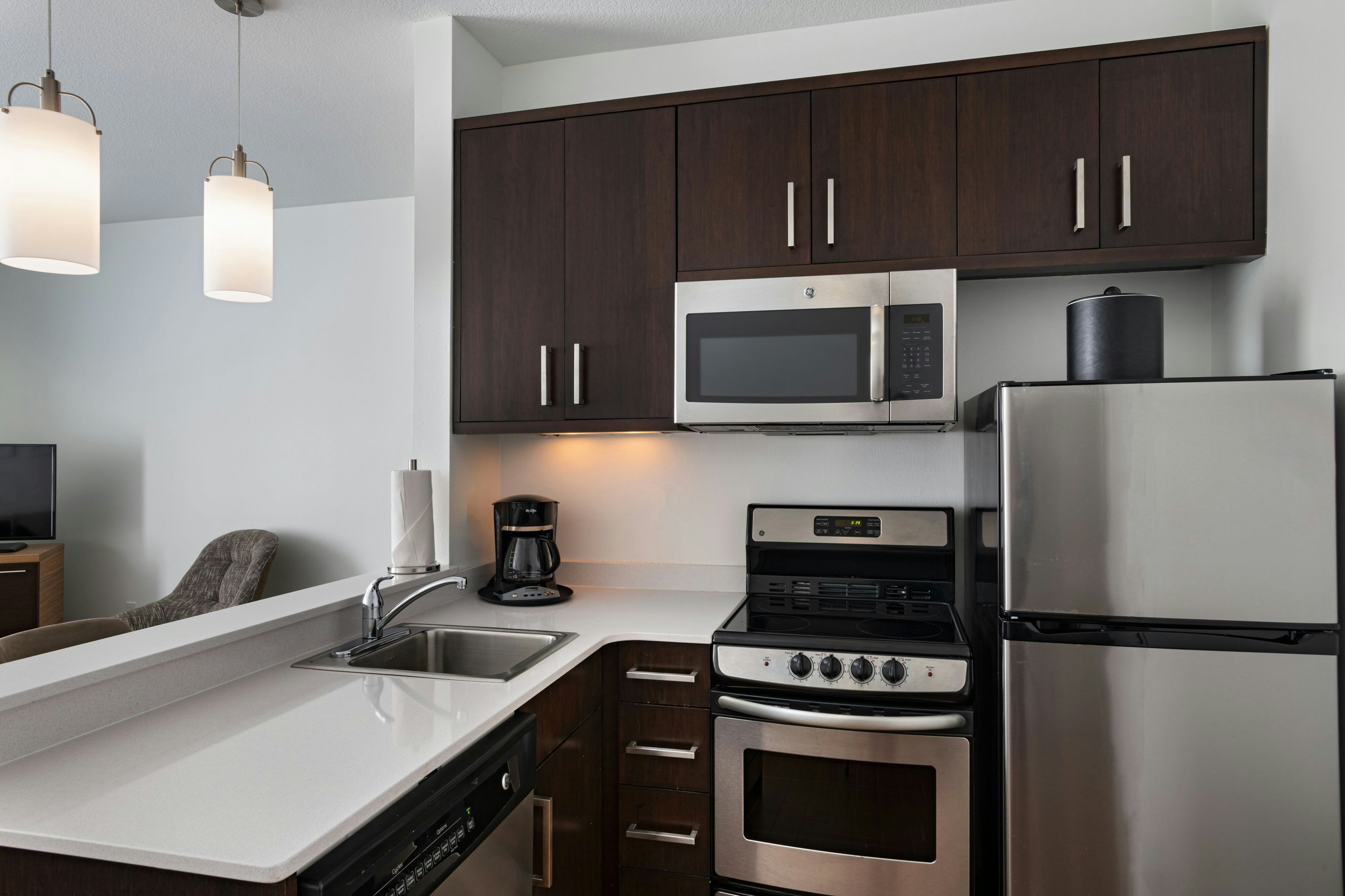 TownePlace Suites by Marriott Ames-guestroom-One Bedroom Suite - Kitchen.jpg