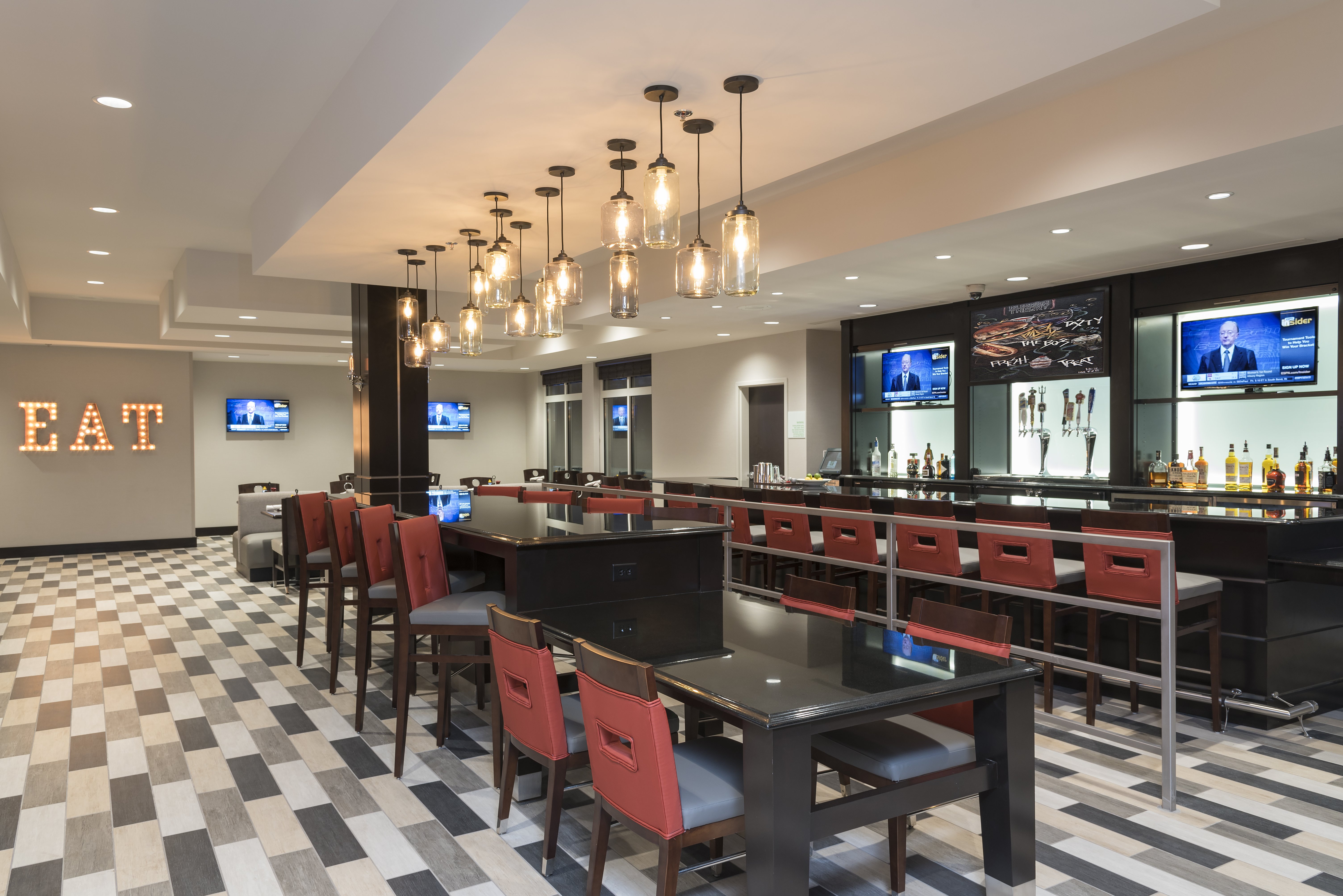 The centralized bar adds a social aspect to the restaurant