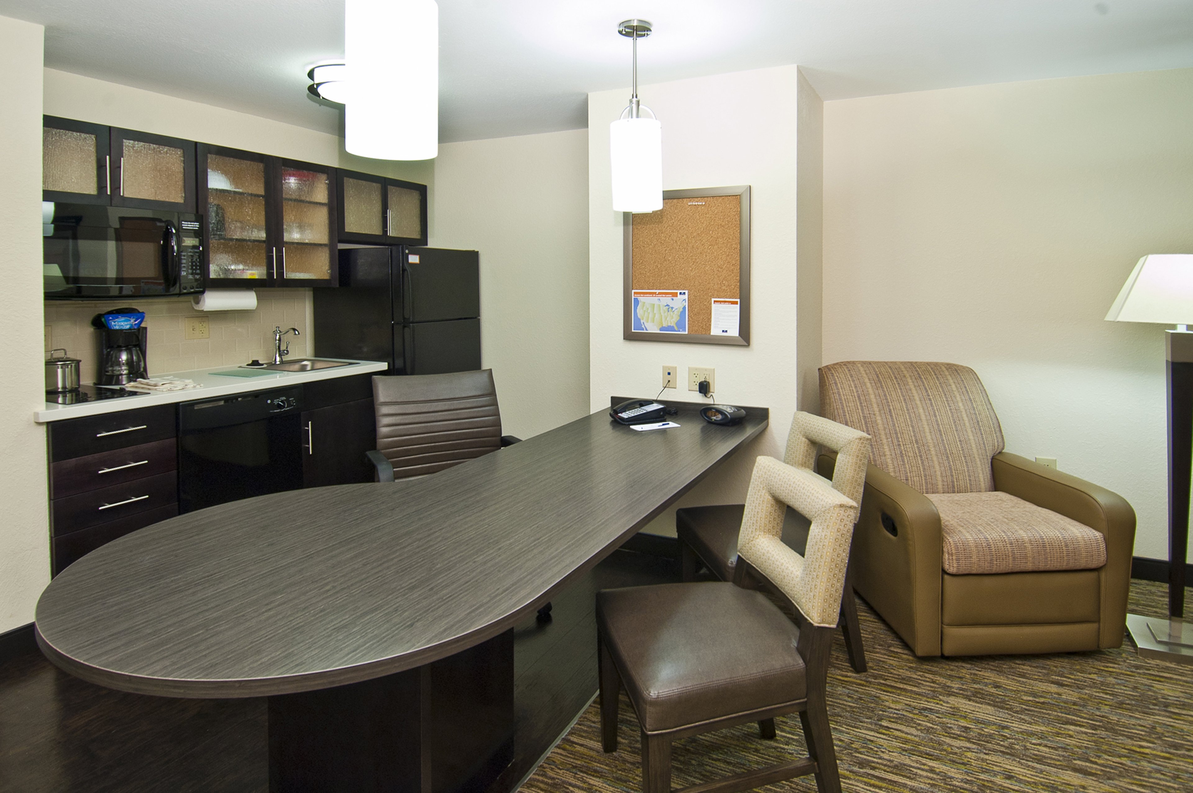 CANDLEWOOD SUITES LITHIA SPRING BY-guestroom-One Bedroom Suite Kitchen with stove top, dishwasher, all utensils.jpg