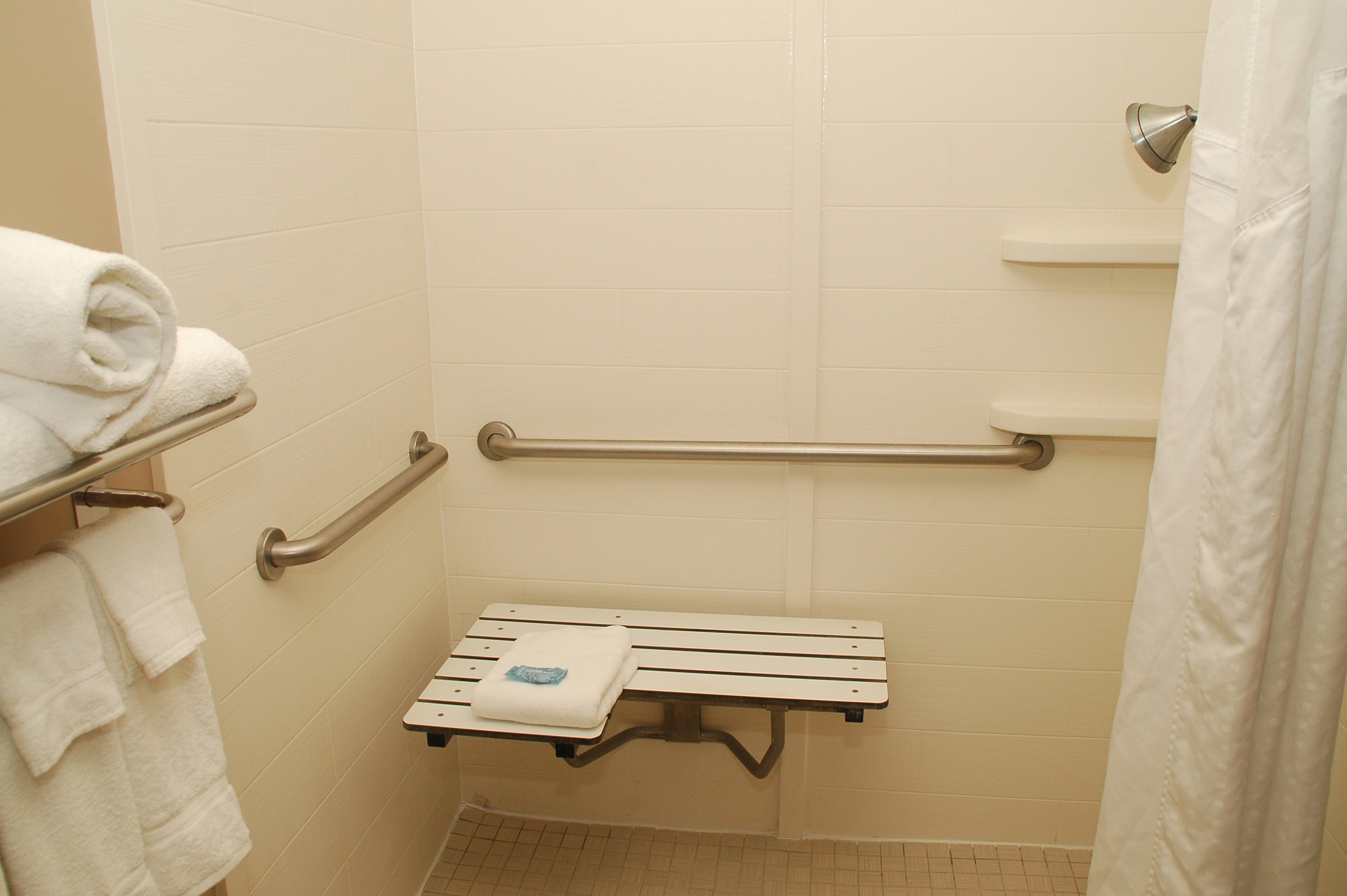 HOLIDAY INN EXP HTLS AND STES-guestroom-Handicapped Roll in Shower.jpg