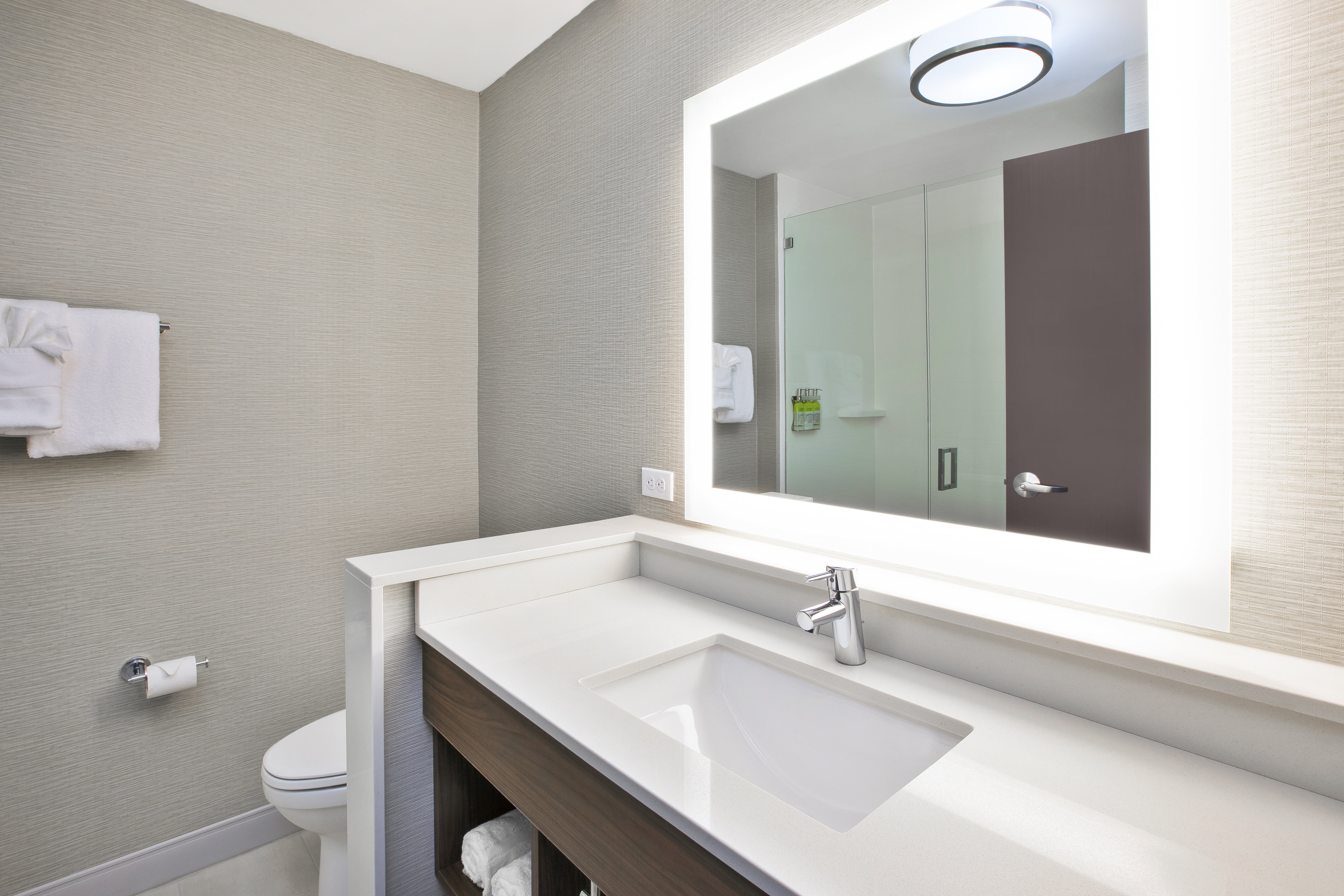 Spacious guest bathrooms with ample counter space.