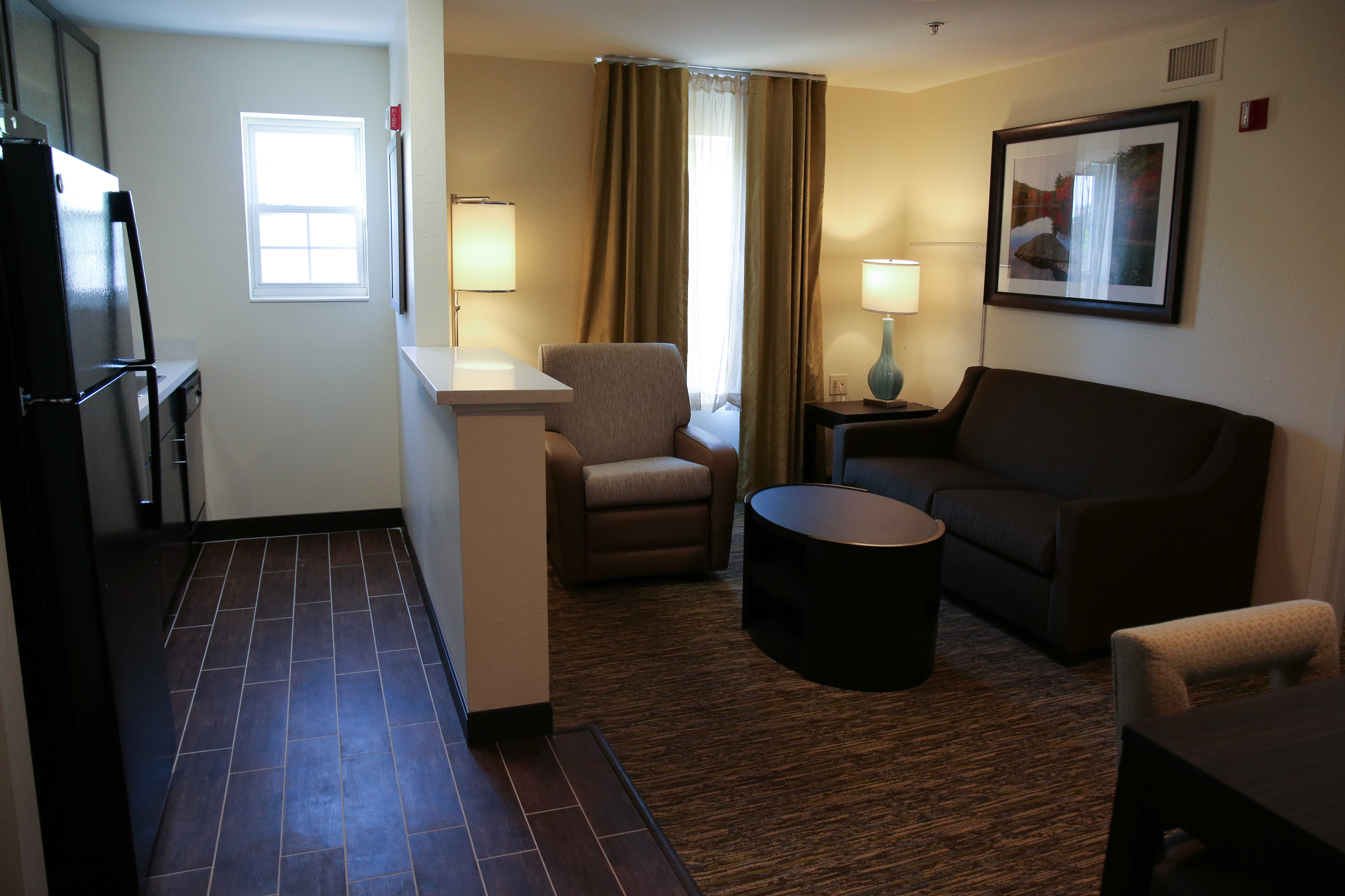 CANDLEWOOD STES SCARBOROUGH-guestroom-One bedroom suite with living room, large television and kitchen..jpg