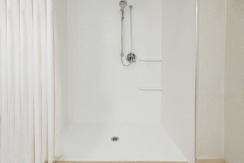 Accessible mobility guest bathroom with roll-in shower