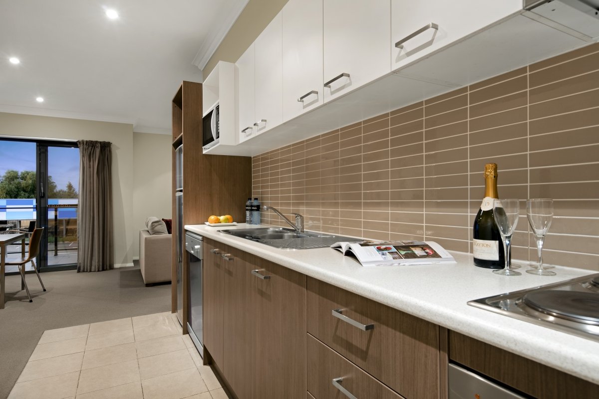 Quest Singleton-guestroom-One, Two and Three Bedroom Apartments Kitchen.jpg