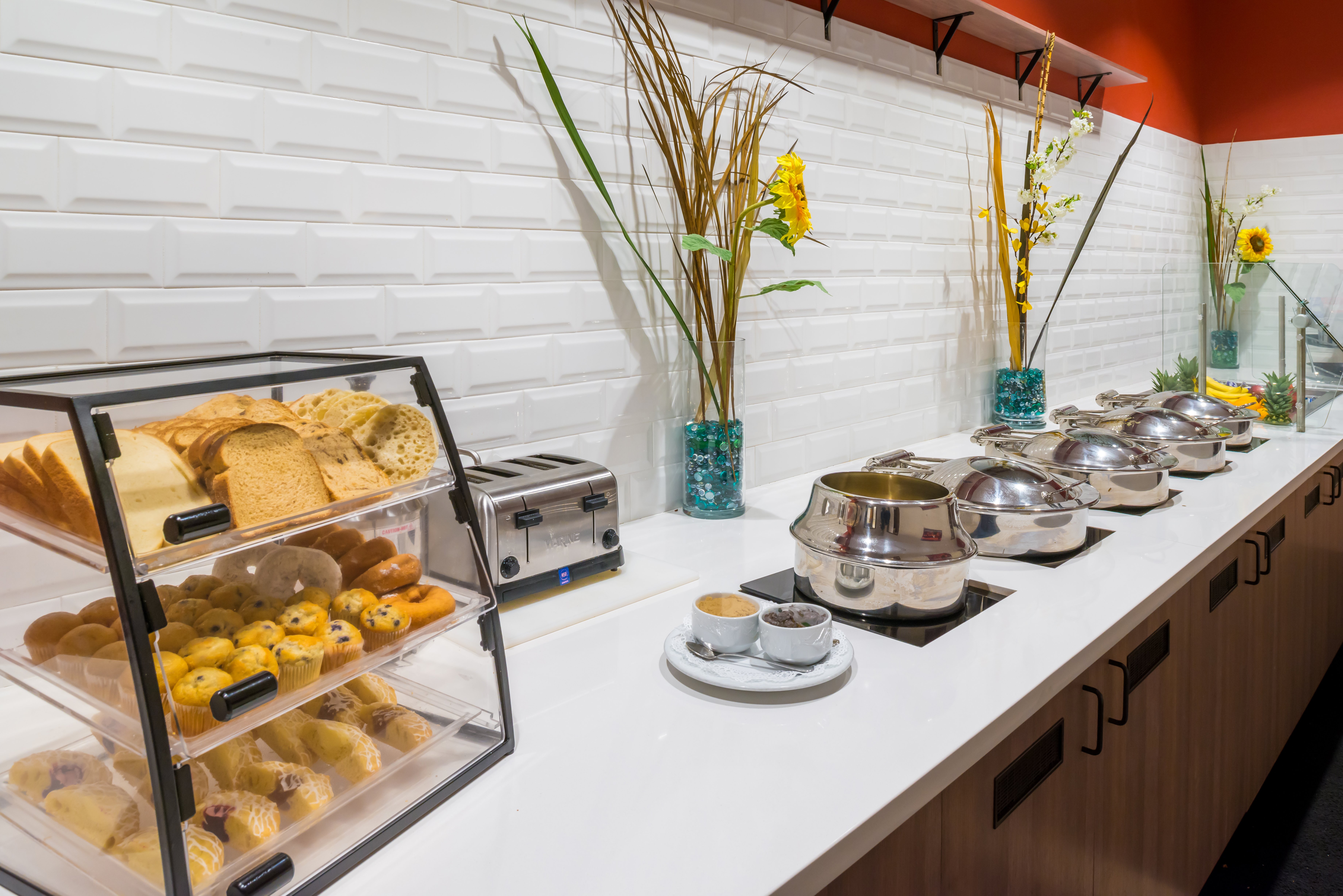 Pastries and hot food items served for breakfast.