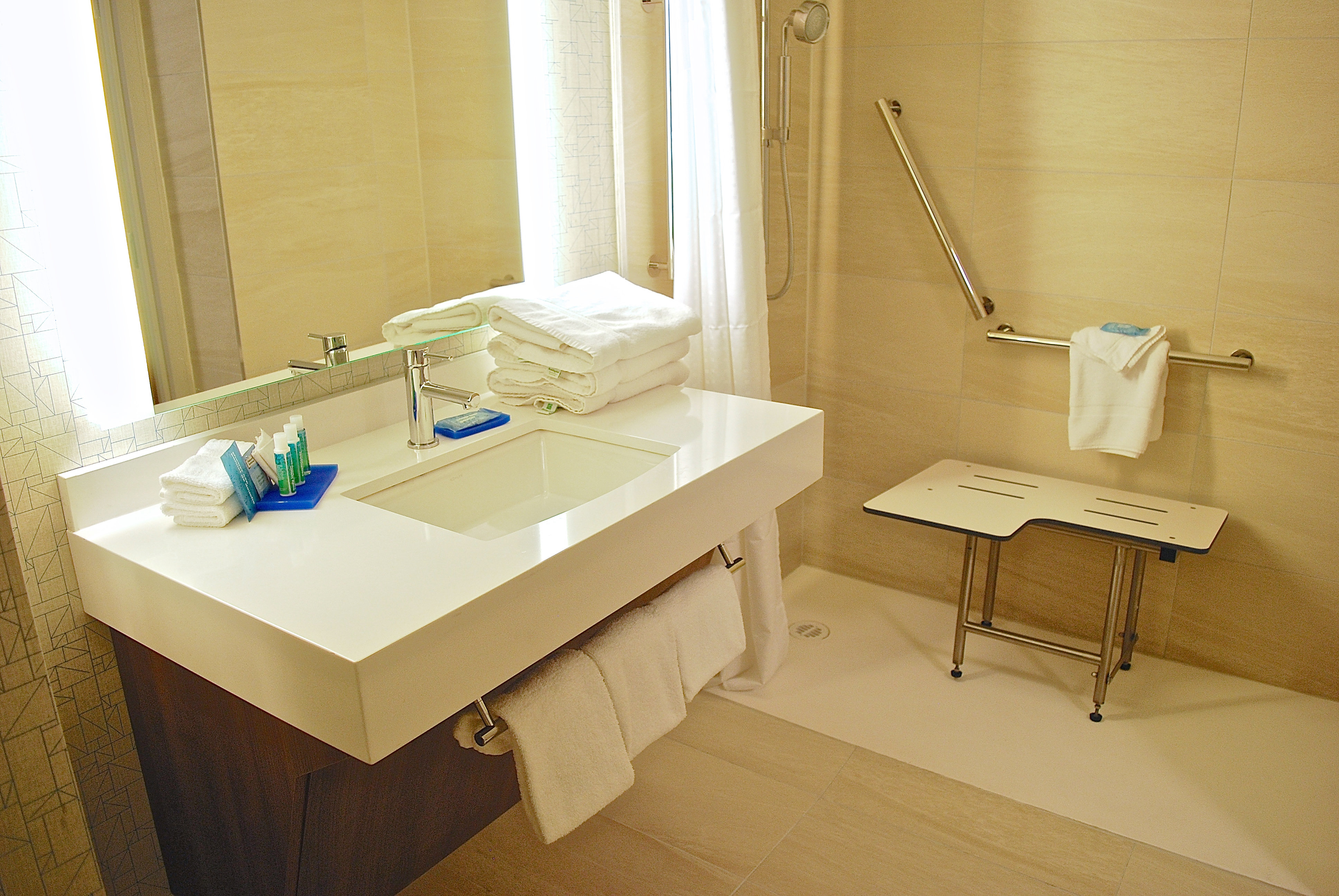 Get ready in our spacious guest bathroom with ADA roll-in shower.