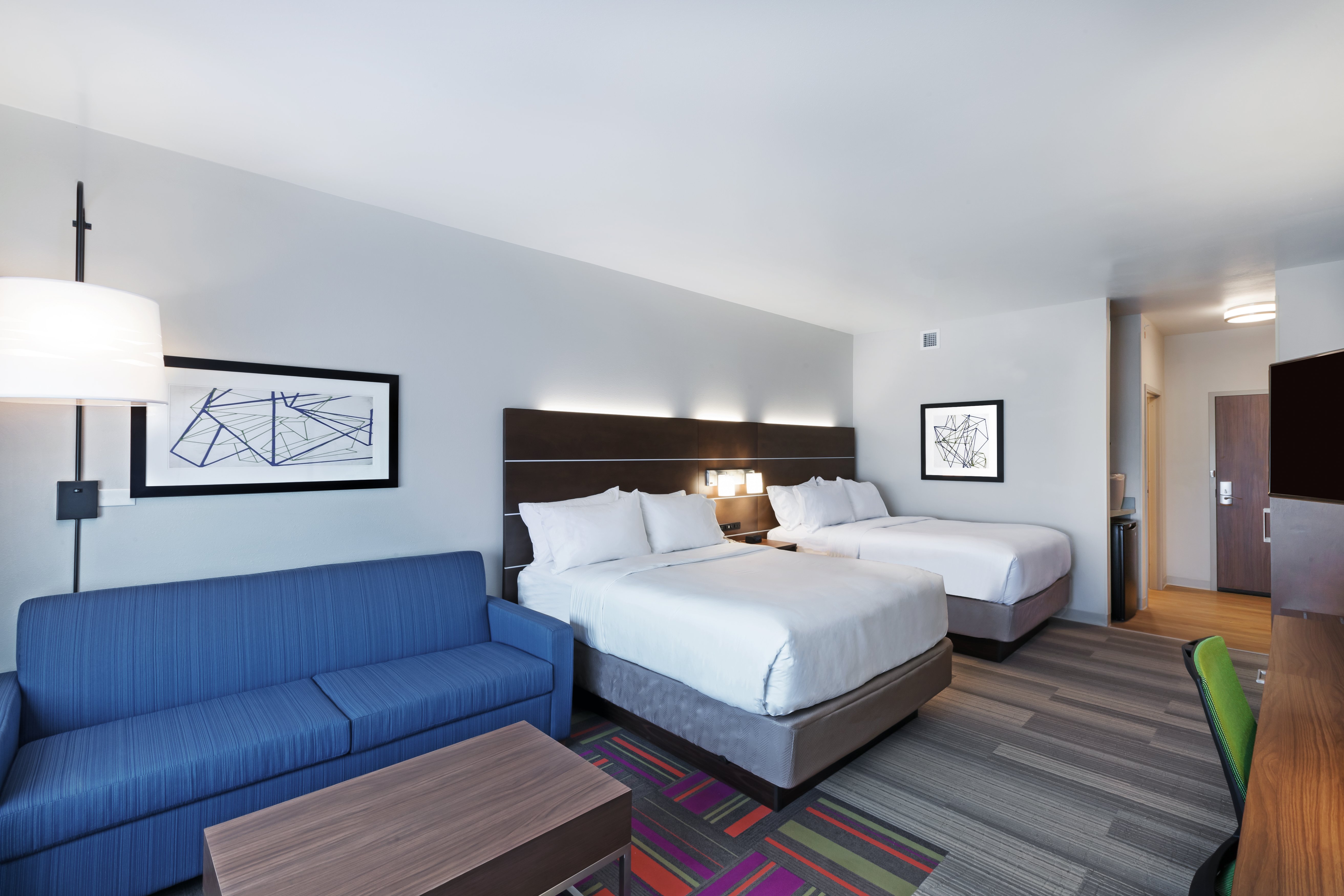 HOLIDAY INN EXP STES CHANUTE BY IHG-guestroom-Holiday Inn Express Chanute 2 Queen Bed Suite with Pull-out Couch.jpg