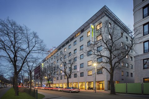 Holiday Inn Express on a broad, tree-lined boulevard in Berlin.