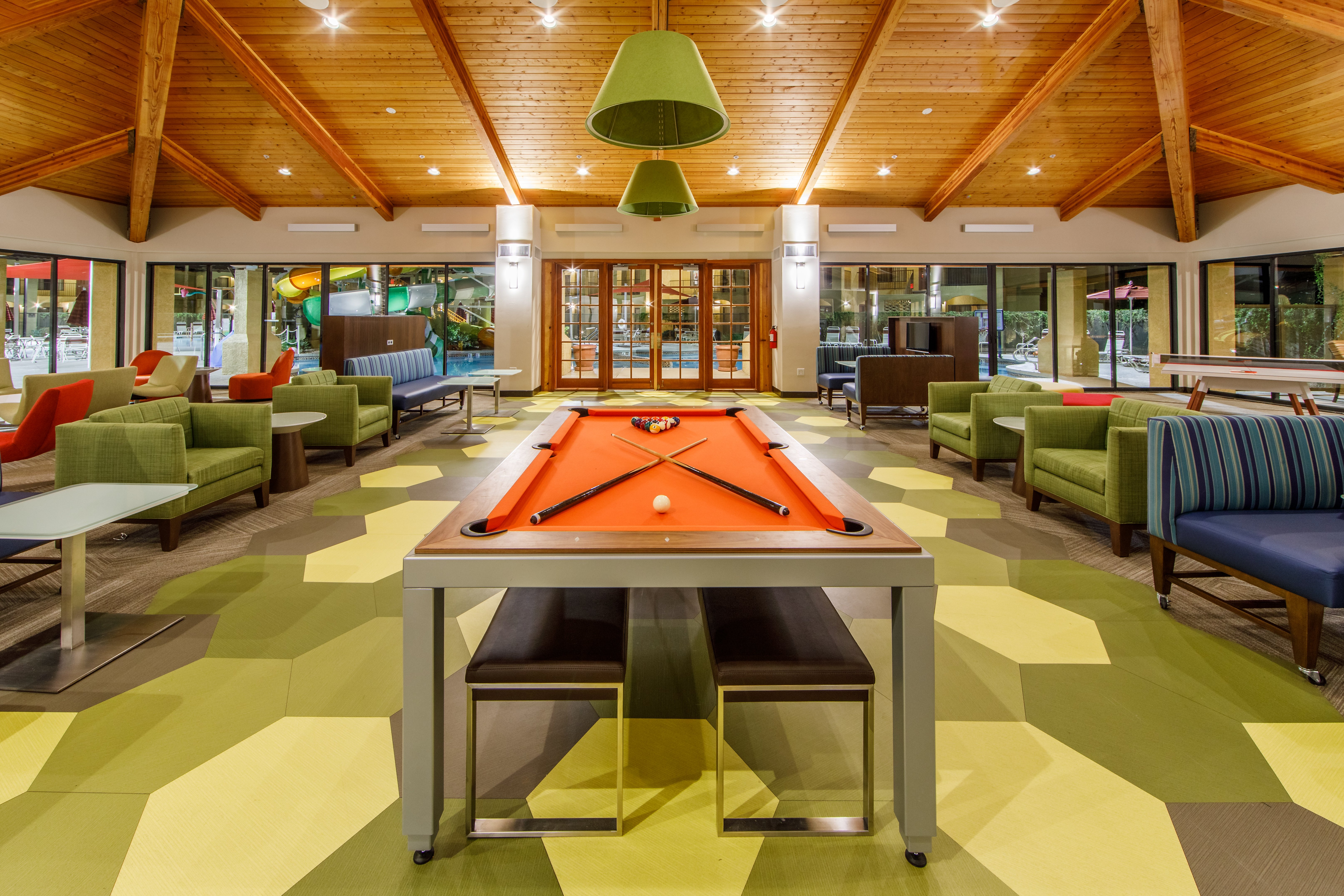 The activity center features a billiards table and lounging space