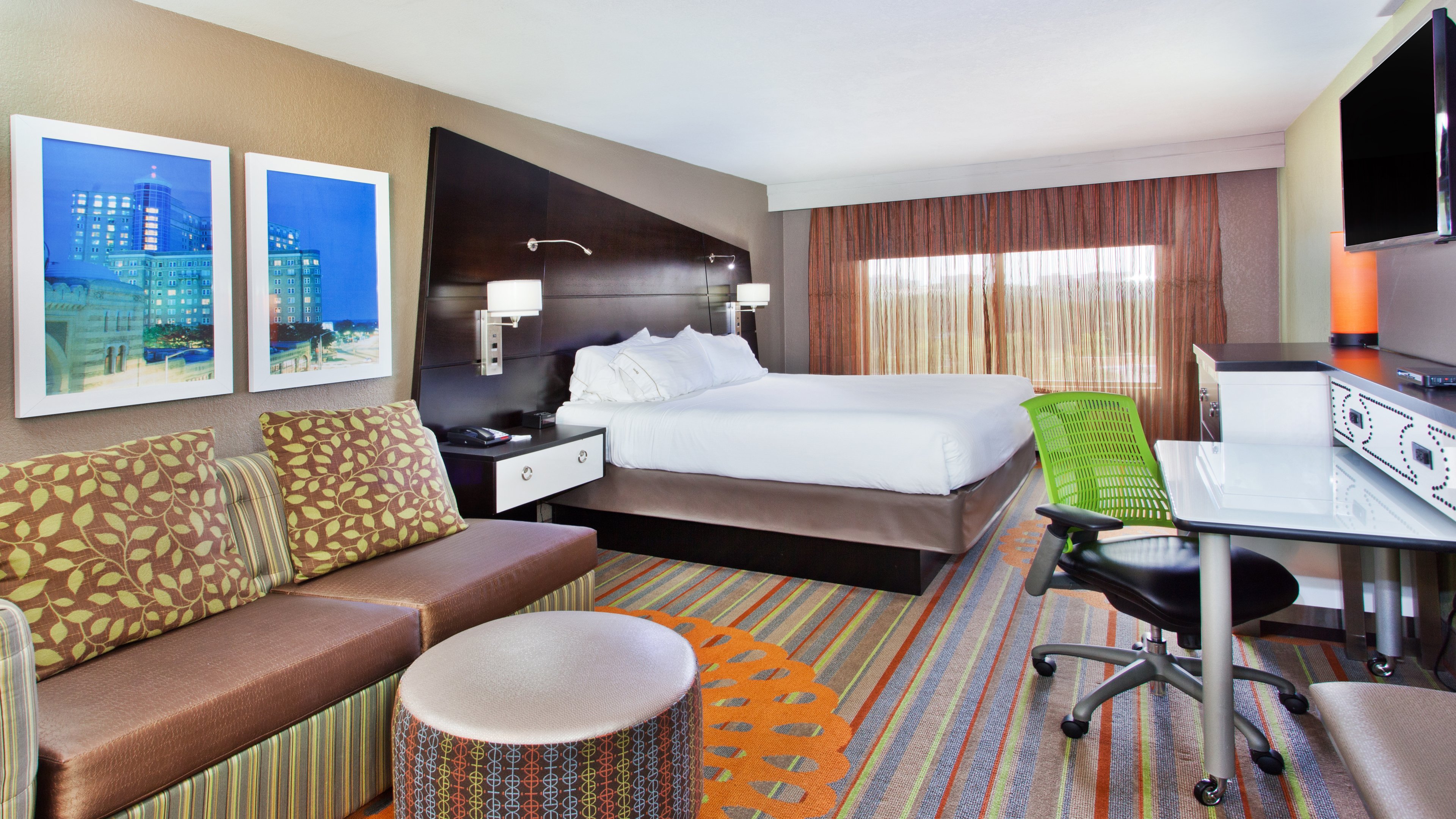 HOLIDAY INN EXP BALLPARK BY IHG-guestroom-Cozy King room featuring a sleeper sofa .jpg