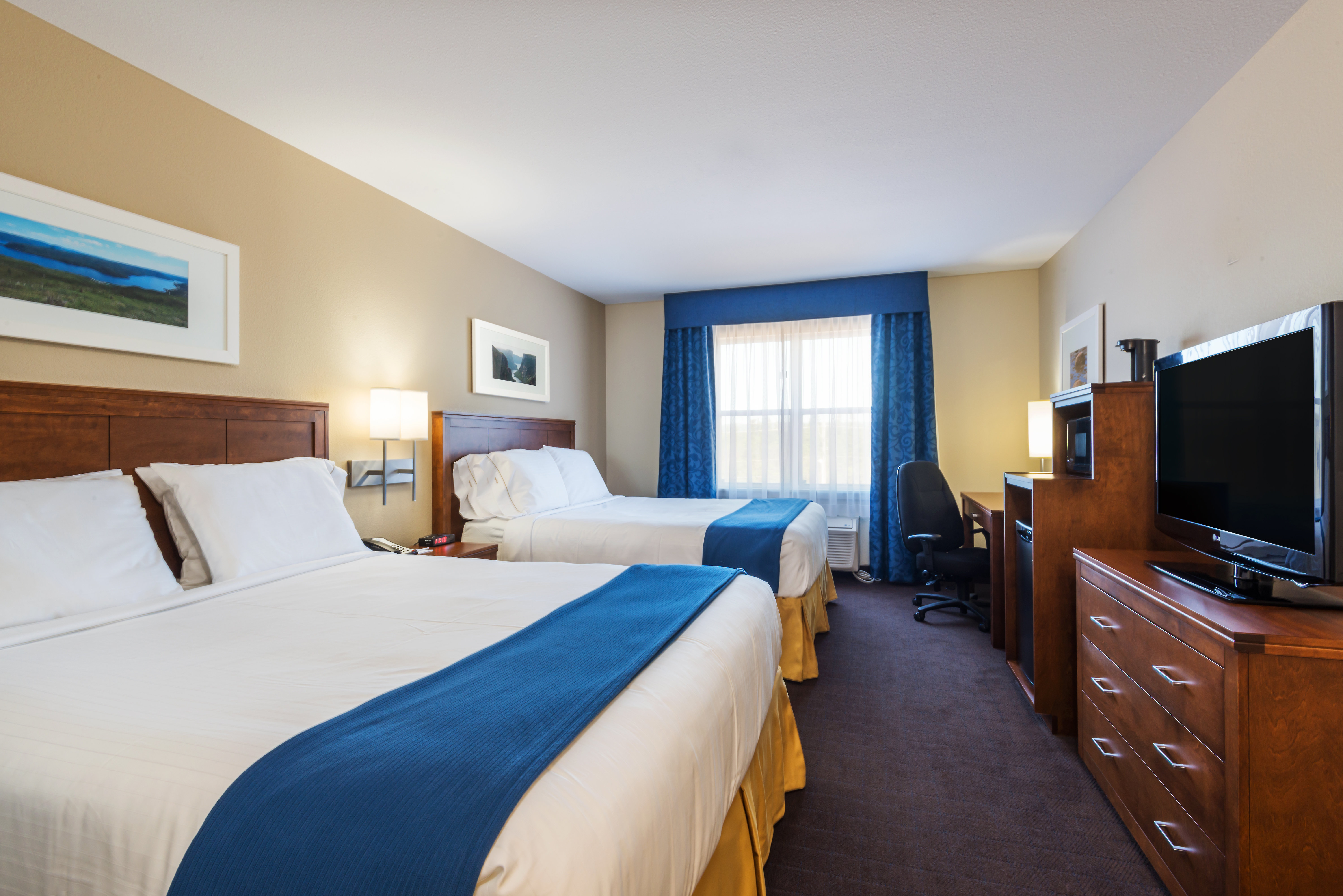 Enjoy a mini-refrigerator and microwave in our Two Queen Bed Rooms