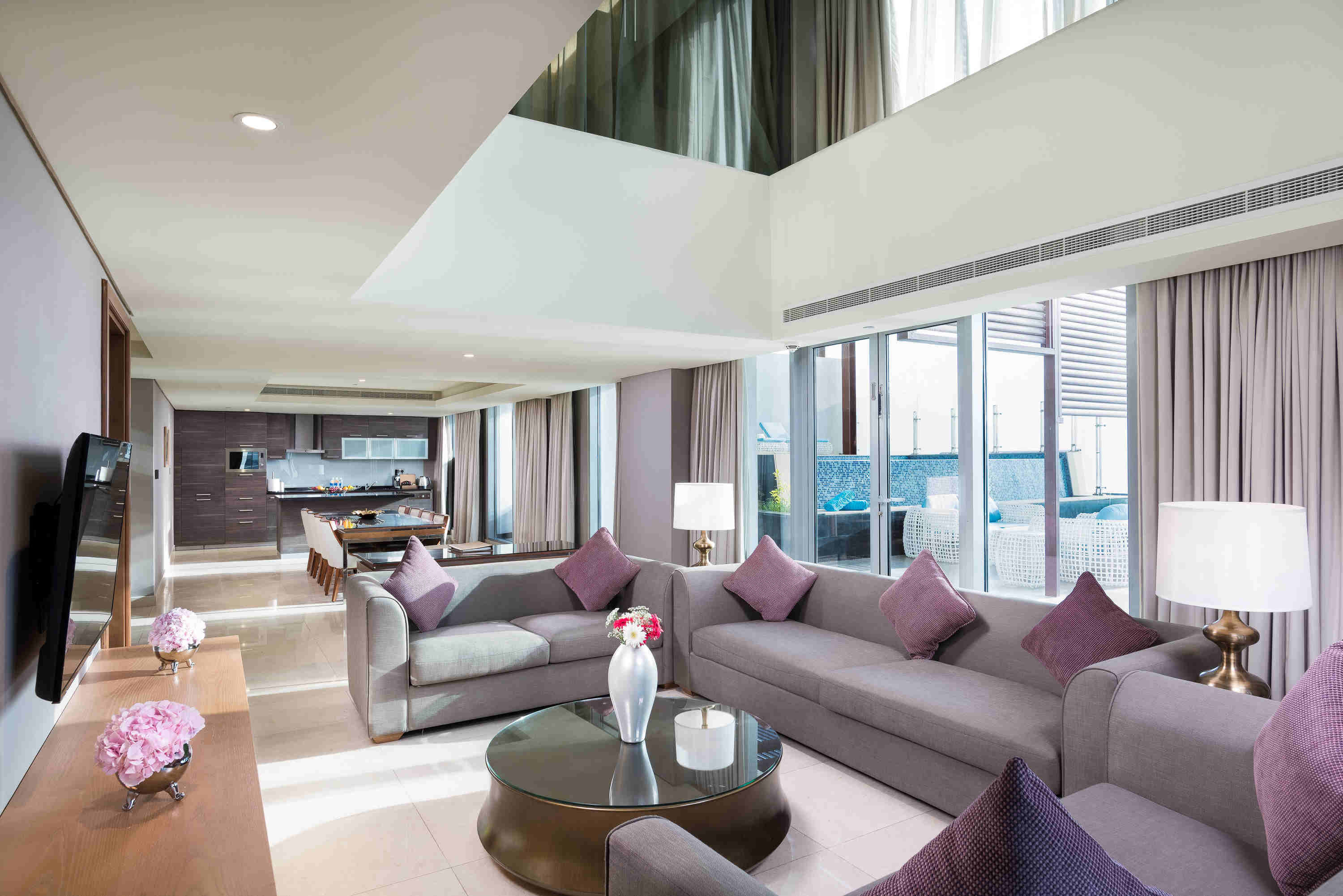 GRAND MILLENNIUM MUSCAT-guestroom-Bedroom Private Pool Living Area.jpg