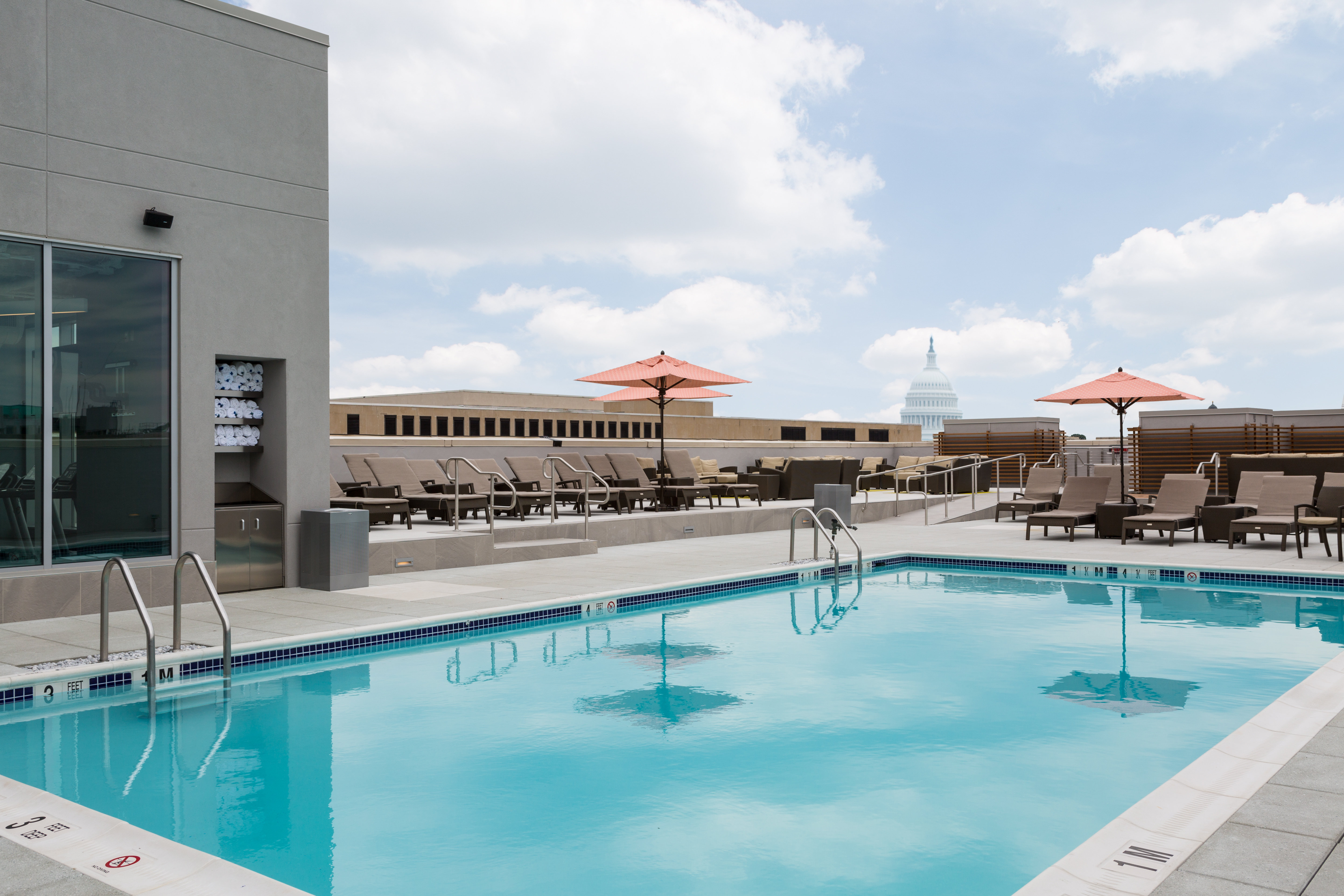 Rooftop pool and bar with a view of the Capitol.