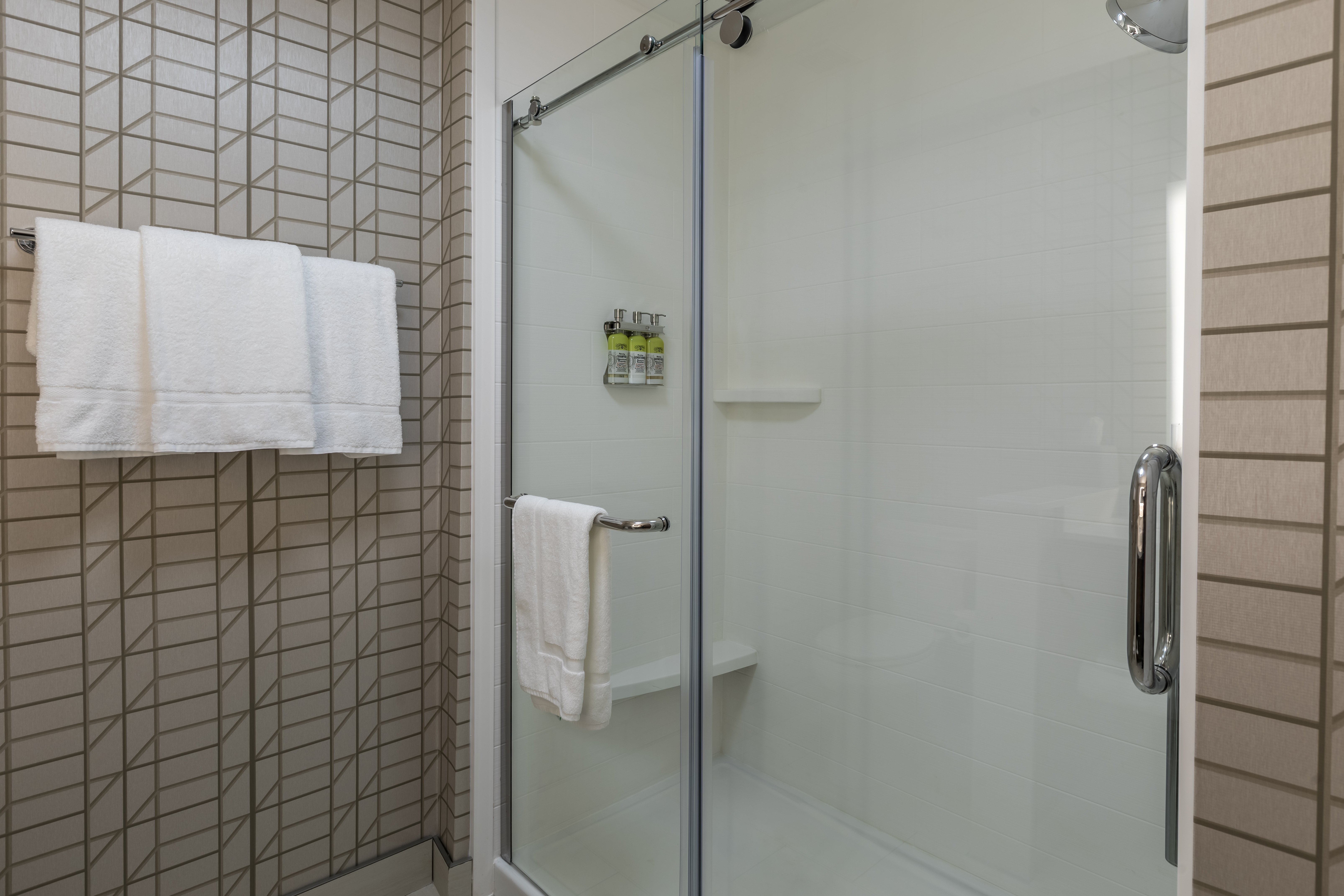 spacious stand up shower with Green Engage Toiletries
