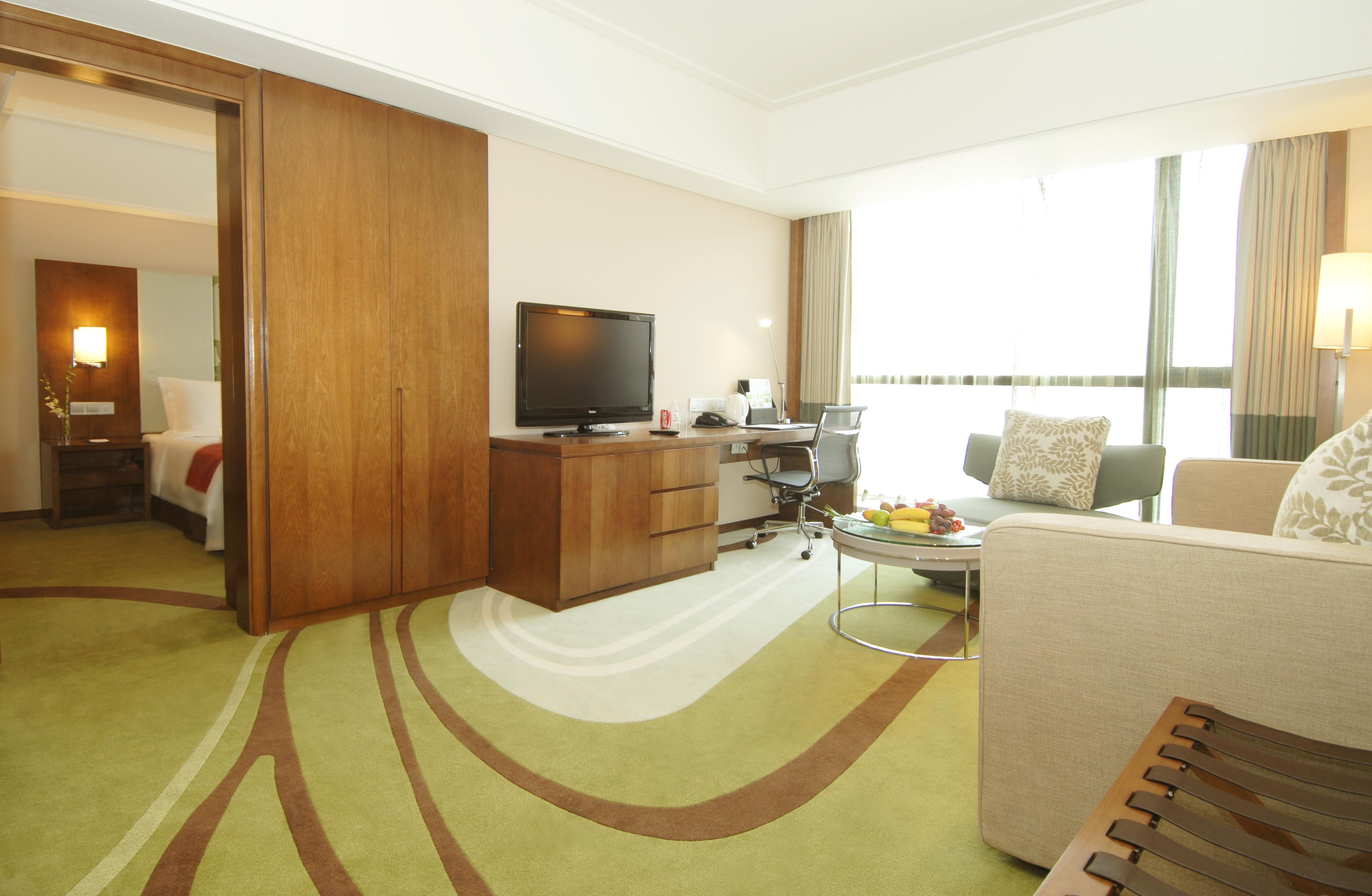 HOLIDAY INN QINGDAO CITY CTR BY IHG-guestroom-Suite.jpg