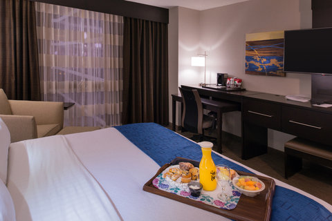 Our modern King Room with comfy side chair, and laptop table