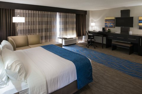 The King Room side of the King Suite features a chaise lounge