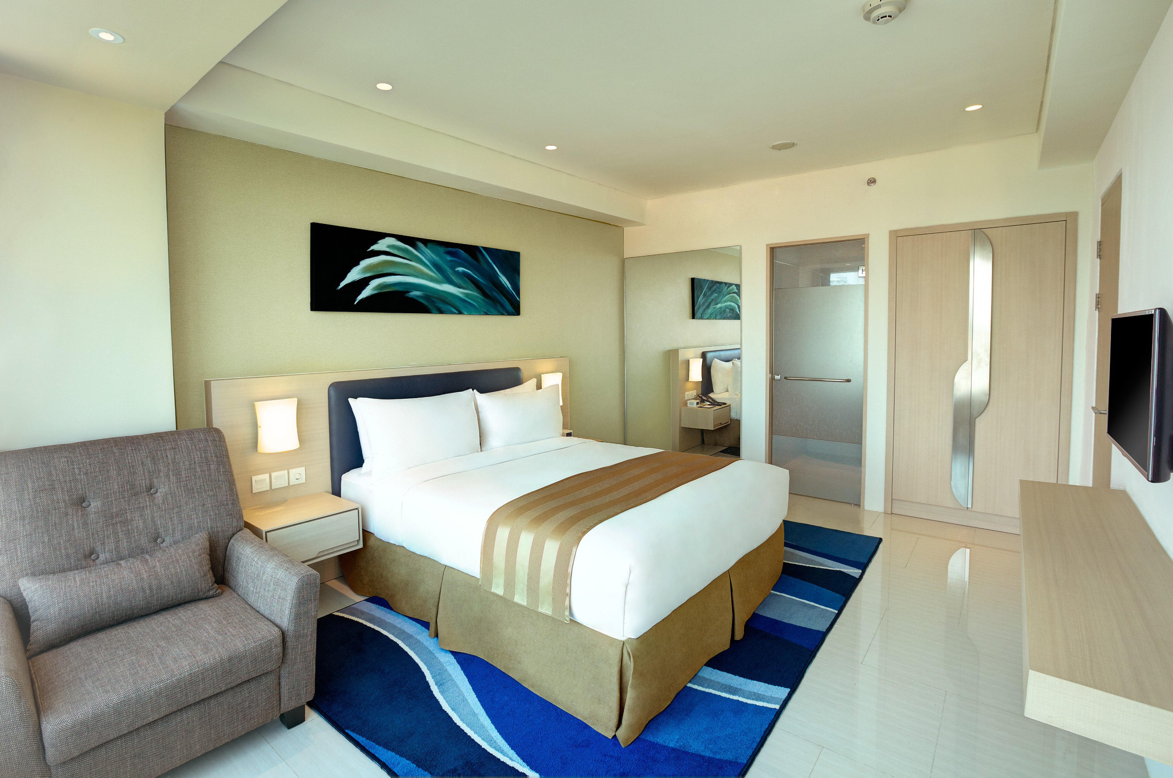 HOLIDAY INN EXP INTERNATIONAL BY IH-guestroom-Suite.jpg