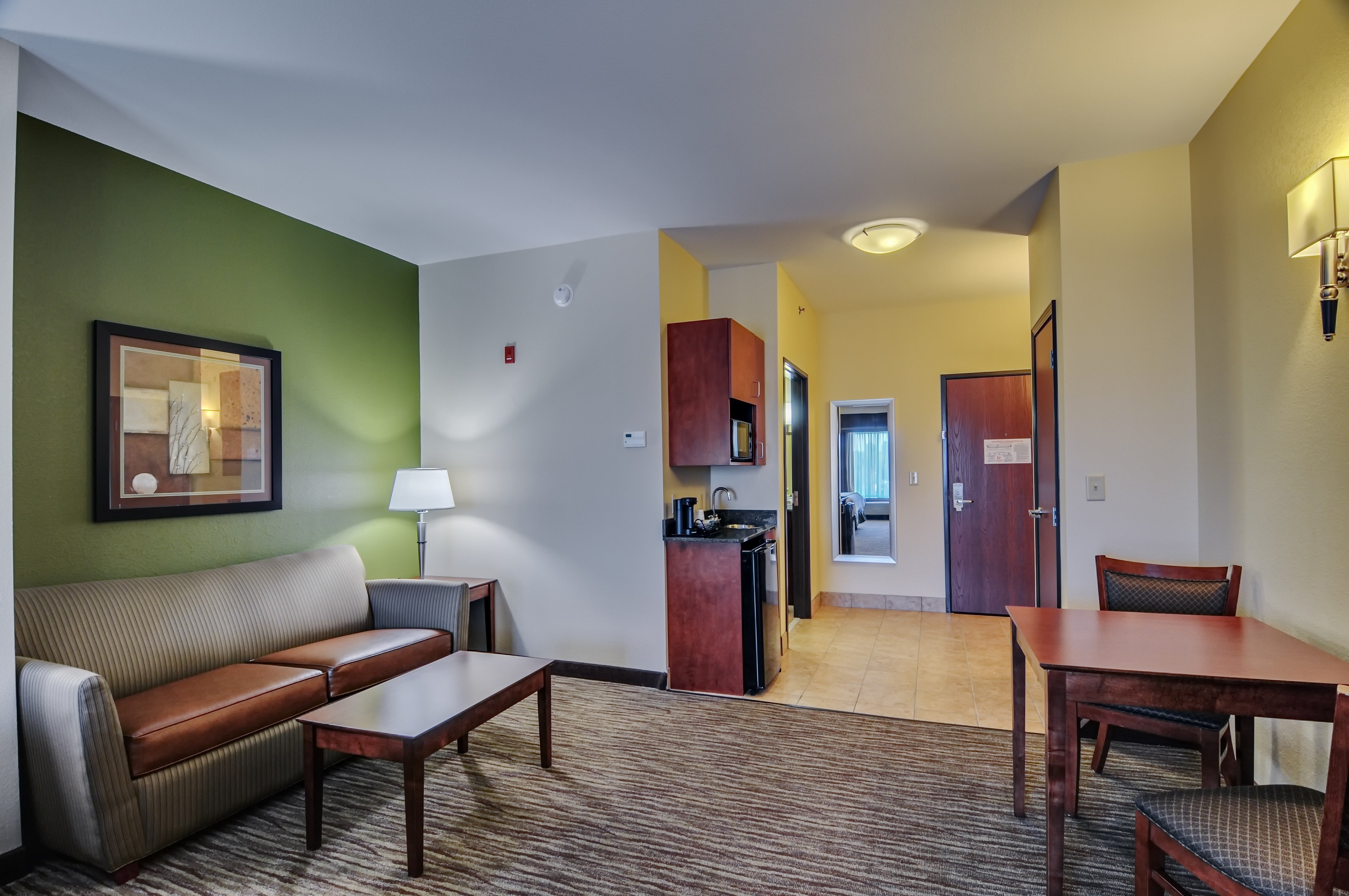 HOLIDAY INN EXP STES WYTHEVILL BY I-guestroom-All of our spacious suites offer sleeper sofas.jpg