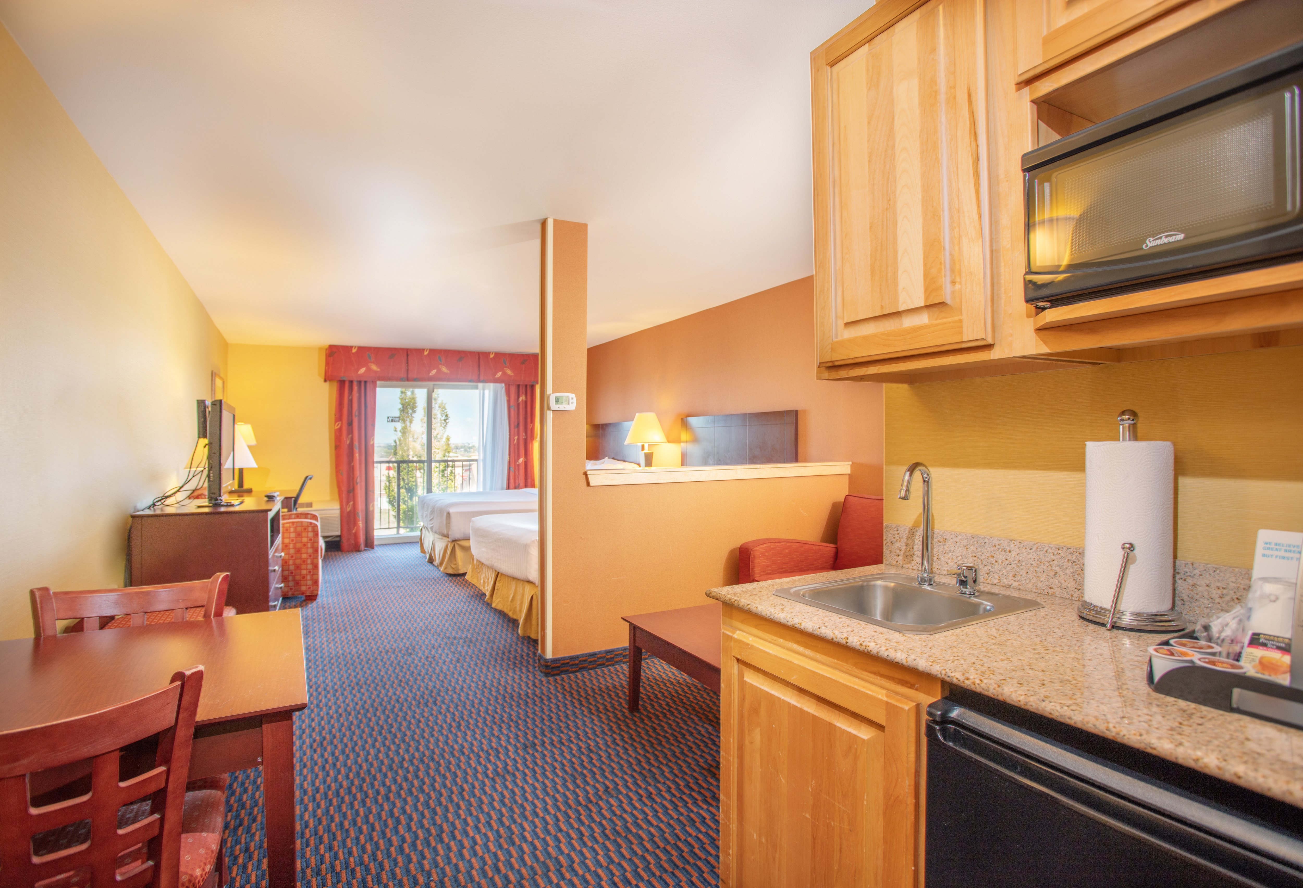 Suites Two Queen Beds with a Sofa Sleeper, Refrigerator & Coffee 