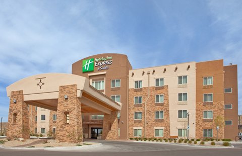 Hotel exterior at sunset, showcasing modern architecture.