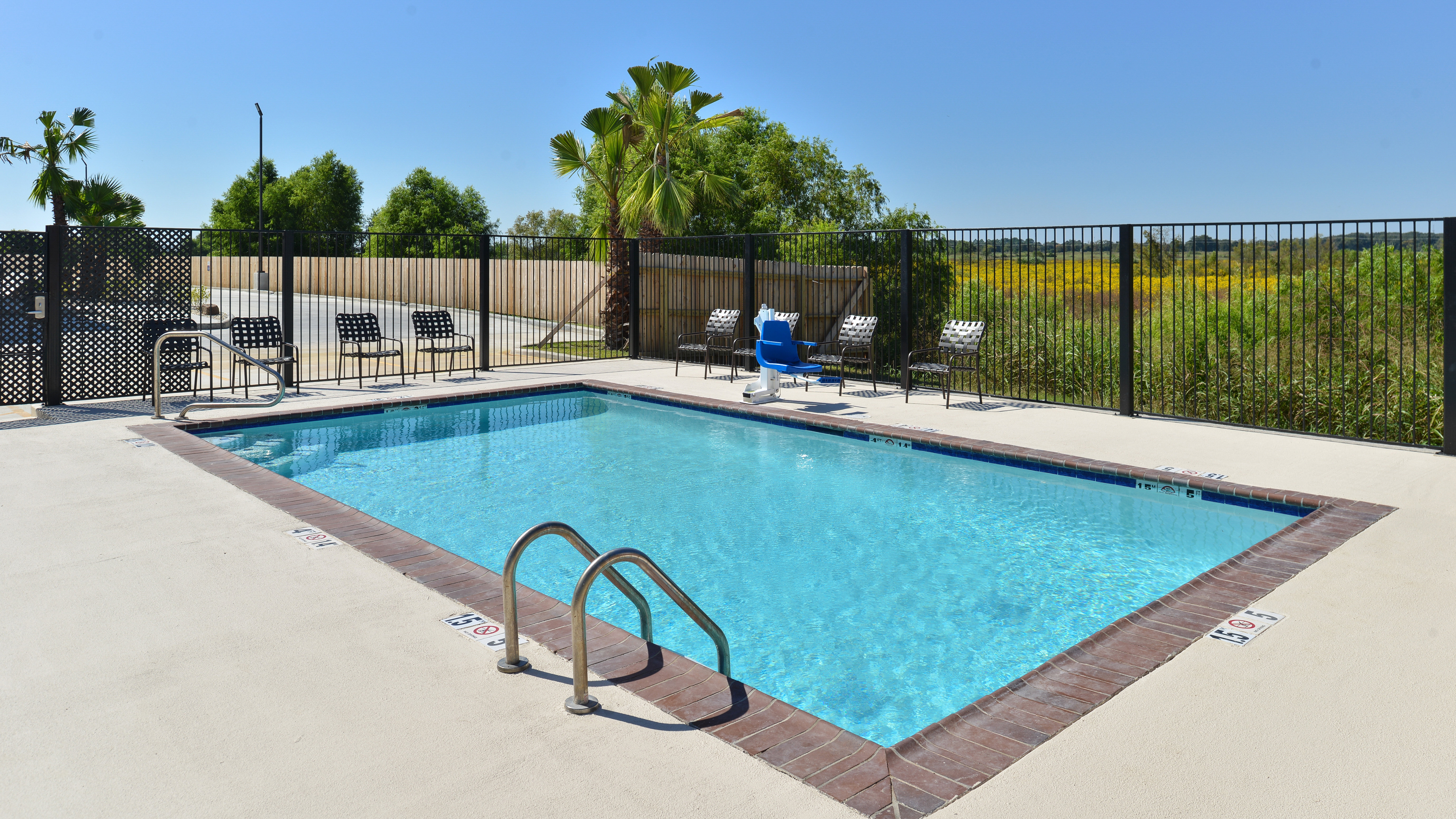 Candlewood Suites Houma Outdoor Swimming Pool and Lounge Chairs