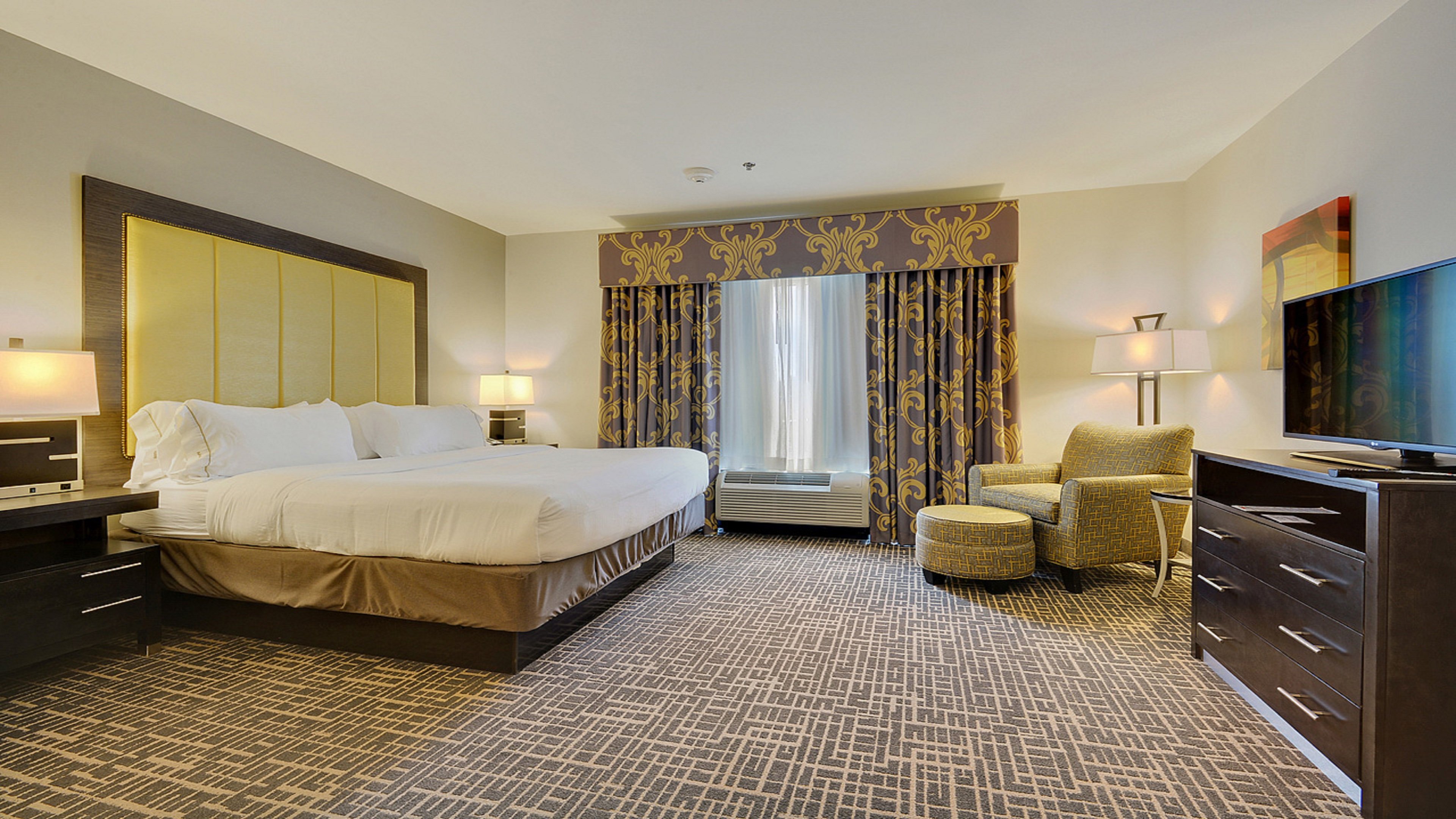 HOLIDAY INN EXP STES GONZALES BY IH-guestroom-King Suite Bed Room.jpg