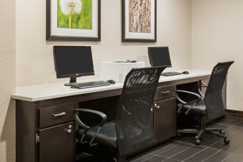 free business center with two computers and printing capabilities