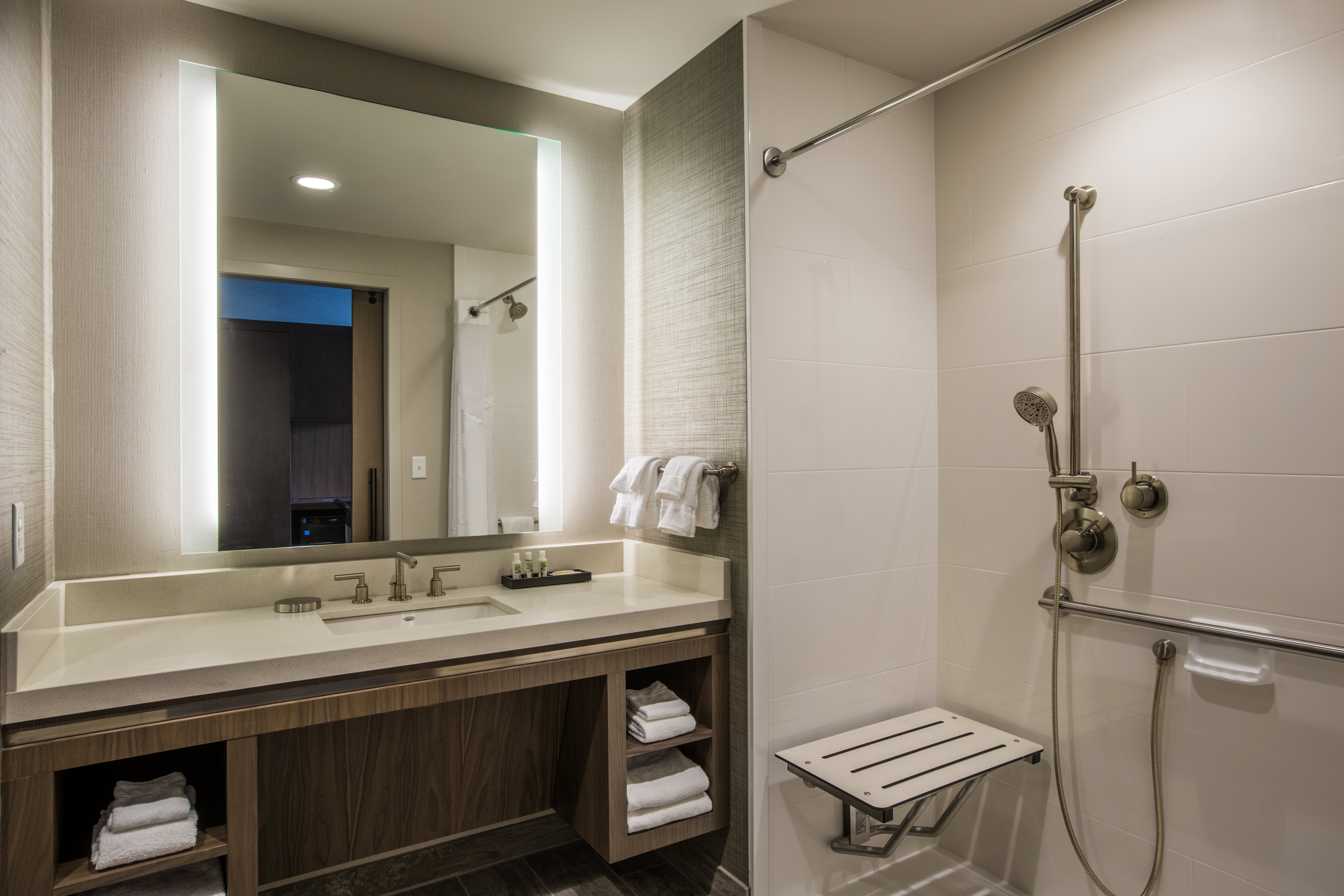Accessible guestroom bathroom with shower seat