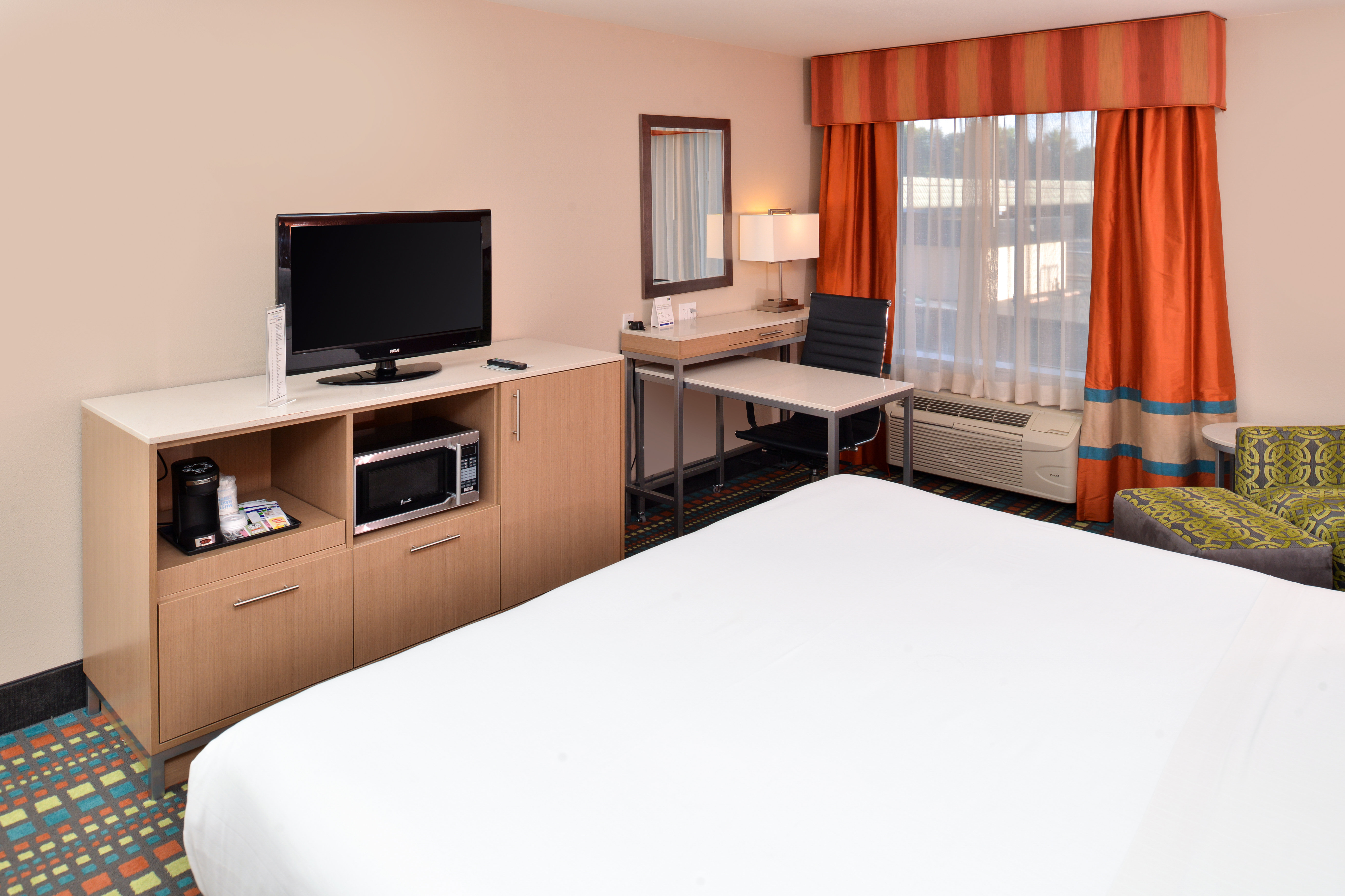 Enjoy extra space to work or sit & watch TV in our king bed room.