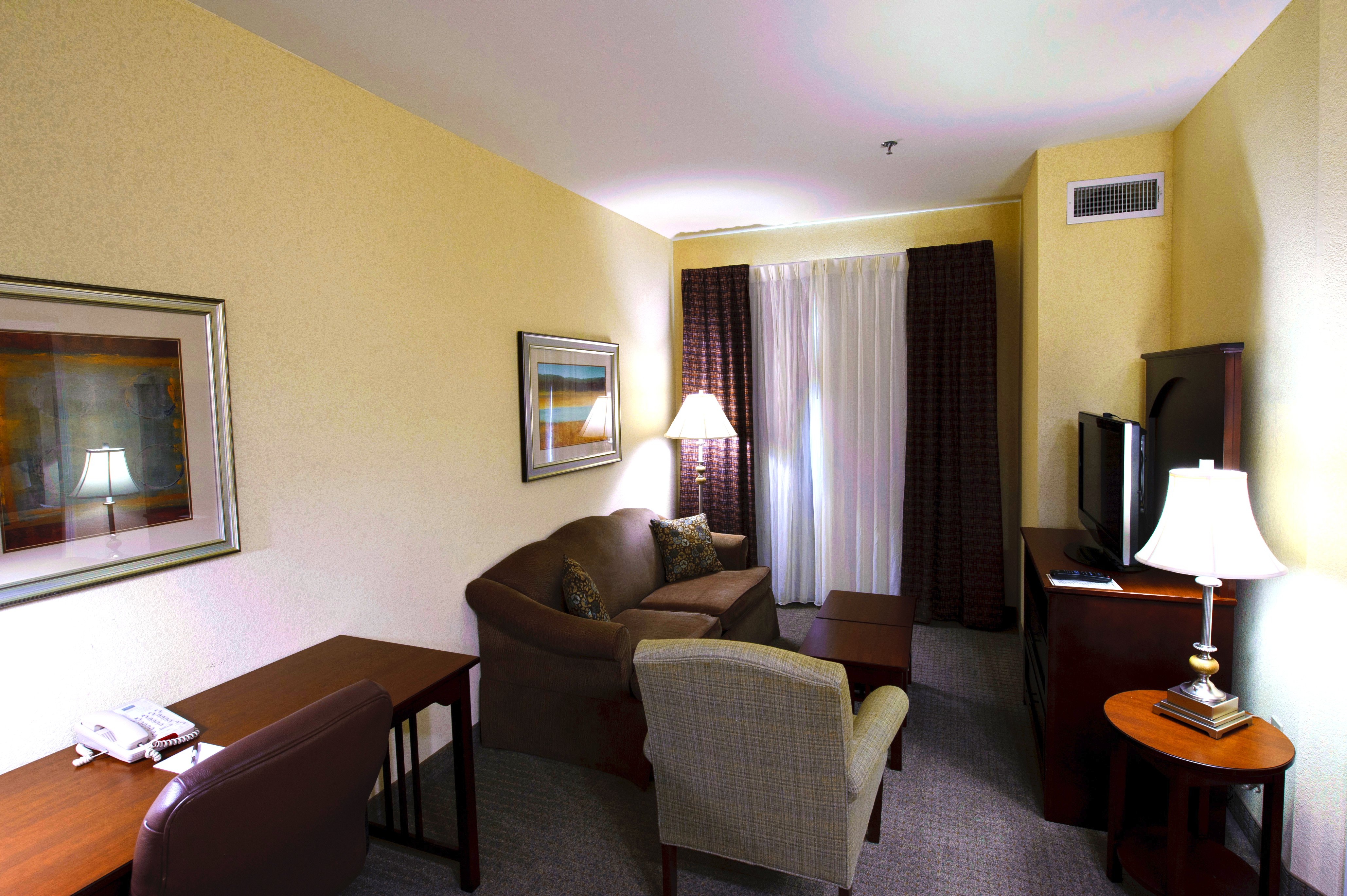STAYBRIDGE SUITES CORPUS CHRIS BY I-guestroom-One Bedroom Suite w/2 Double Beds - Living Area.jpg