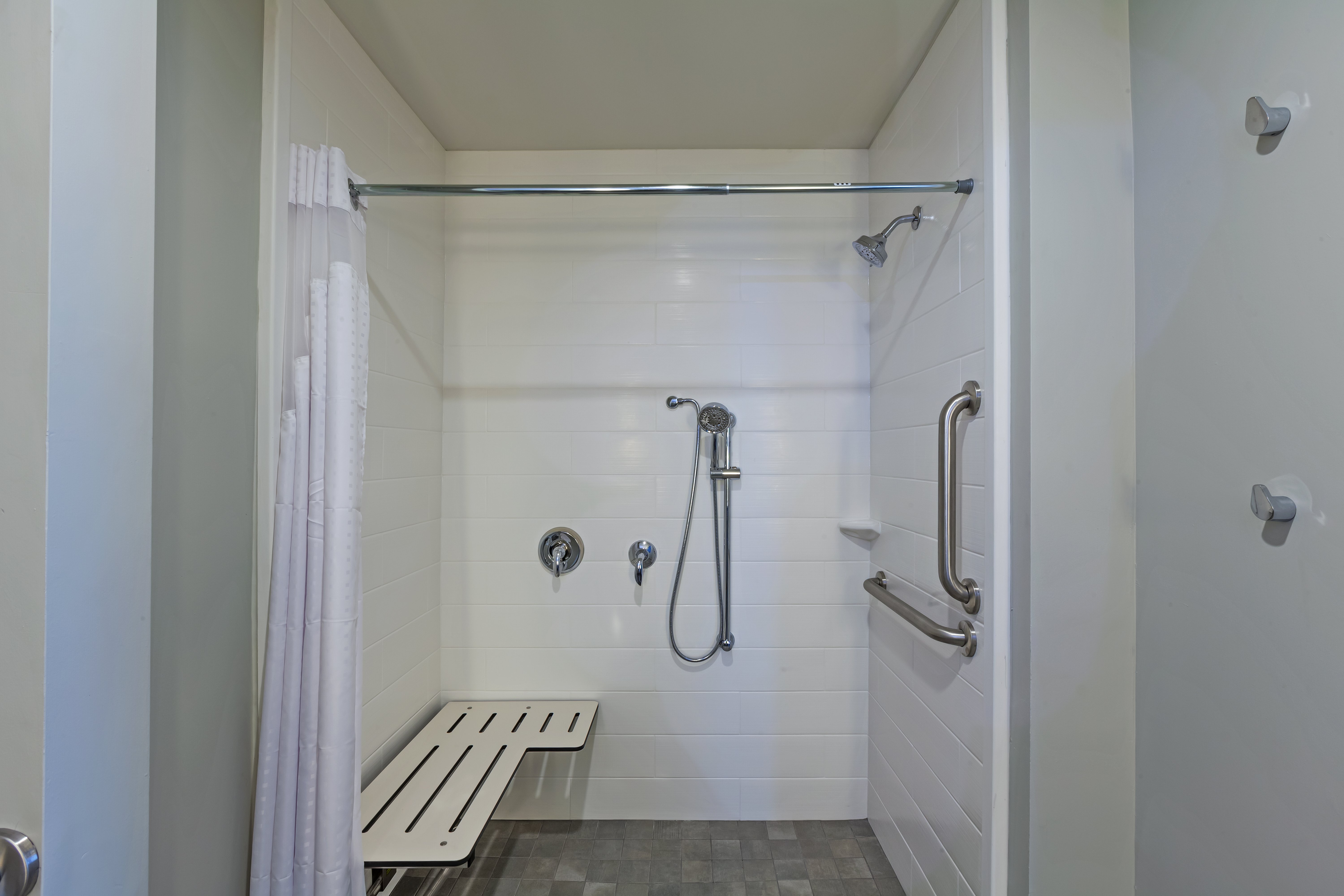 HOLIDAY INN NE - BUSH AIRPORT AREA-guestroom-Spacious accessible guest bathroom with a roll-in shower..jpg