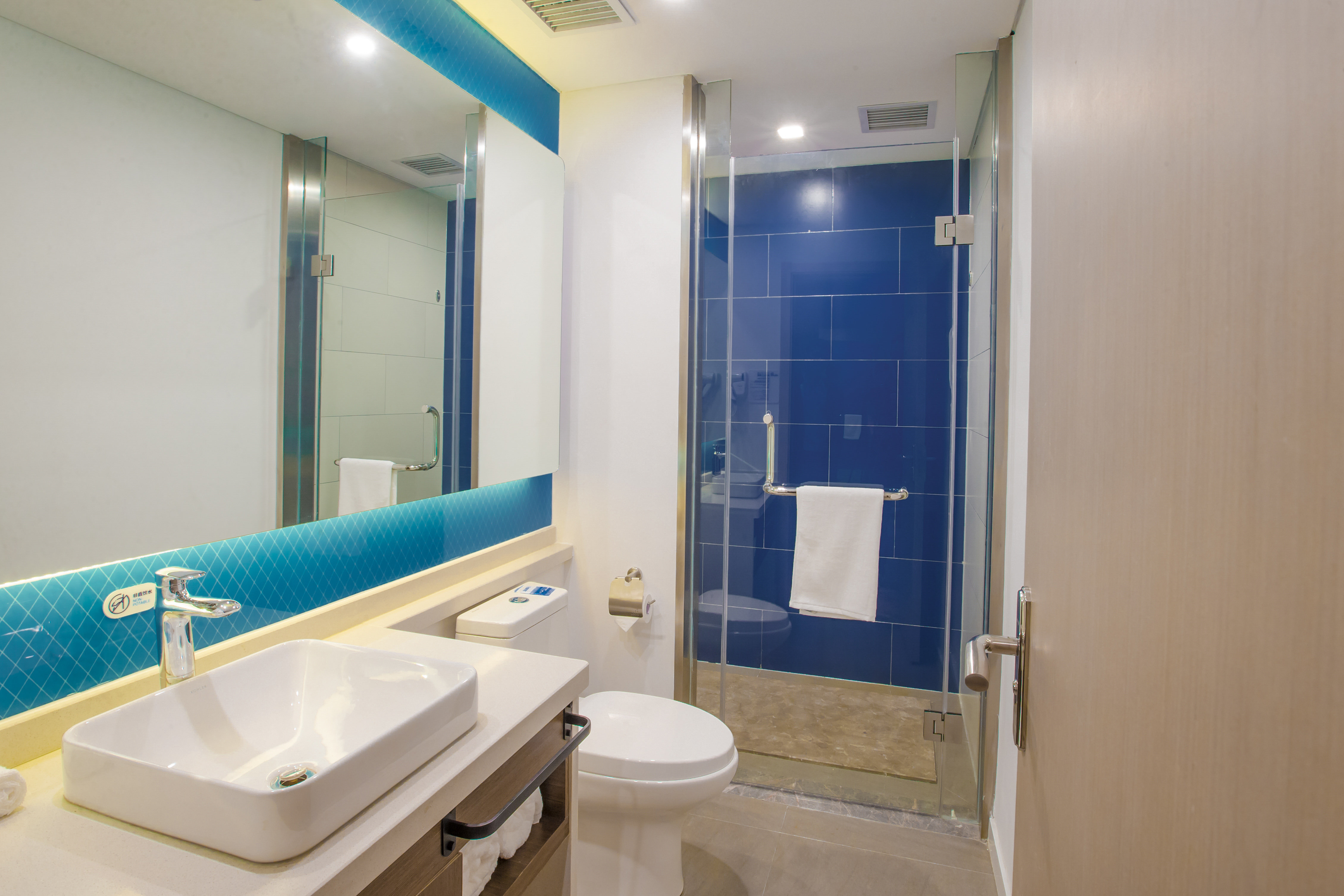 HOLIDAY INN EXP HIGH TECH BY IHG-guestroom-Guest Bathroom.jpg