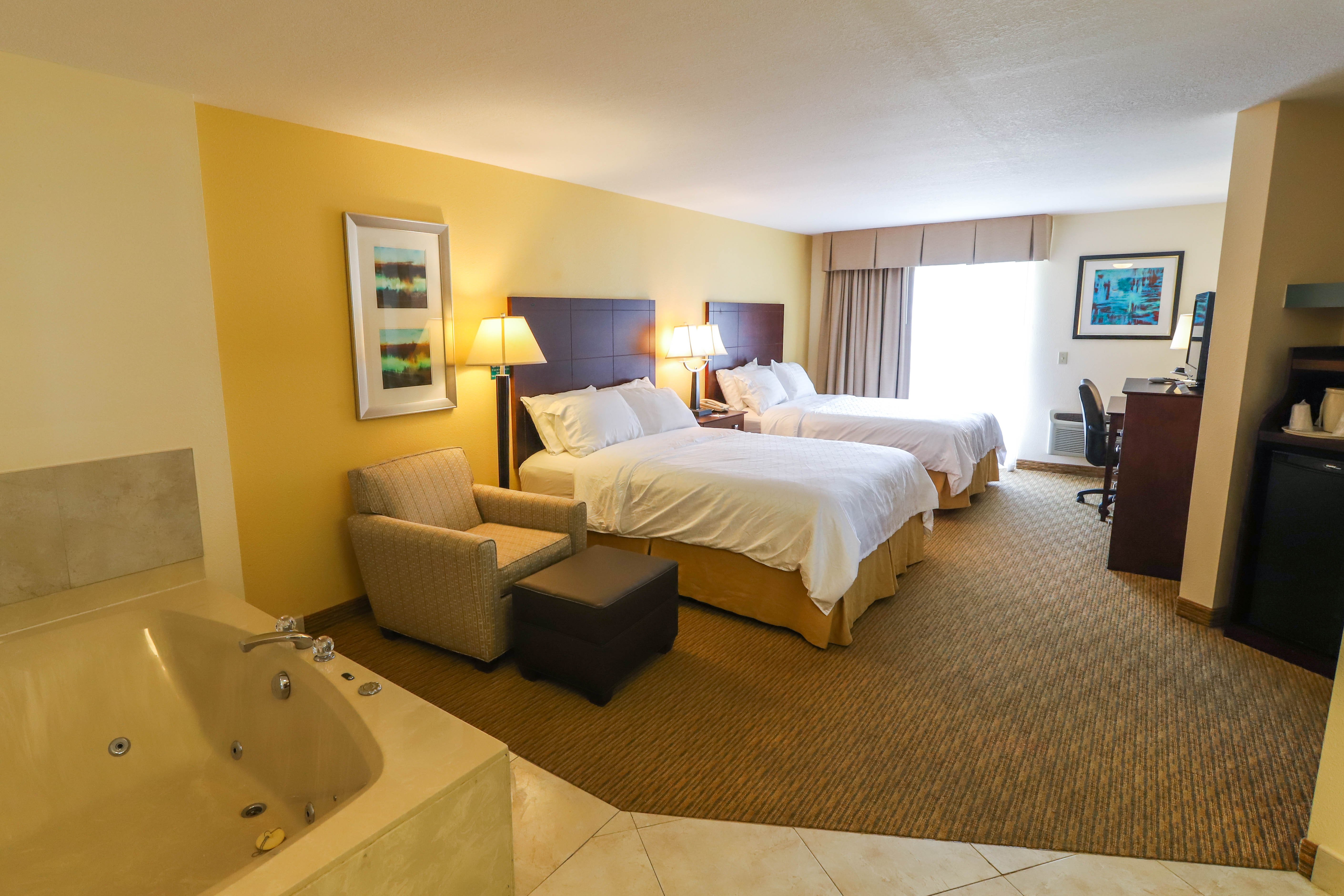 HOLIDAY INN EXPRESS ST IGNACE BY IH-guestroom-Two Queen Beds featuring a comfortable, spacious jetted tub..jpg