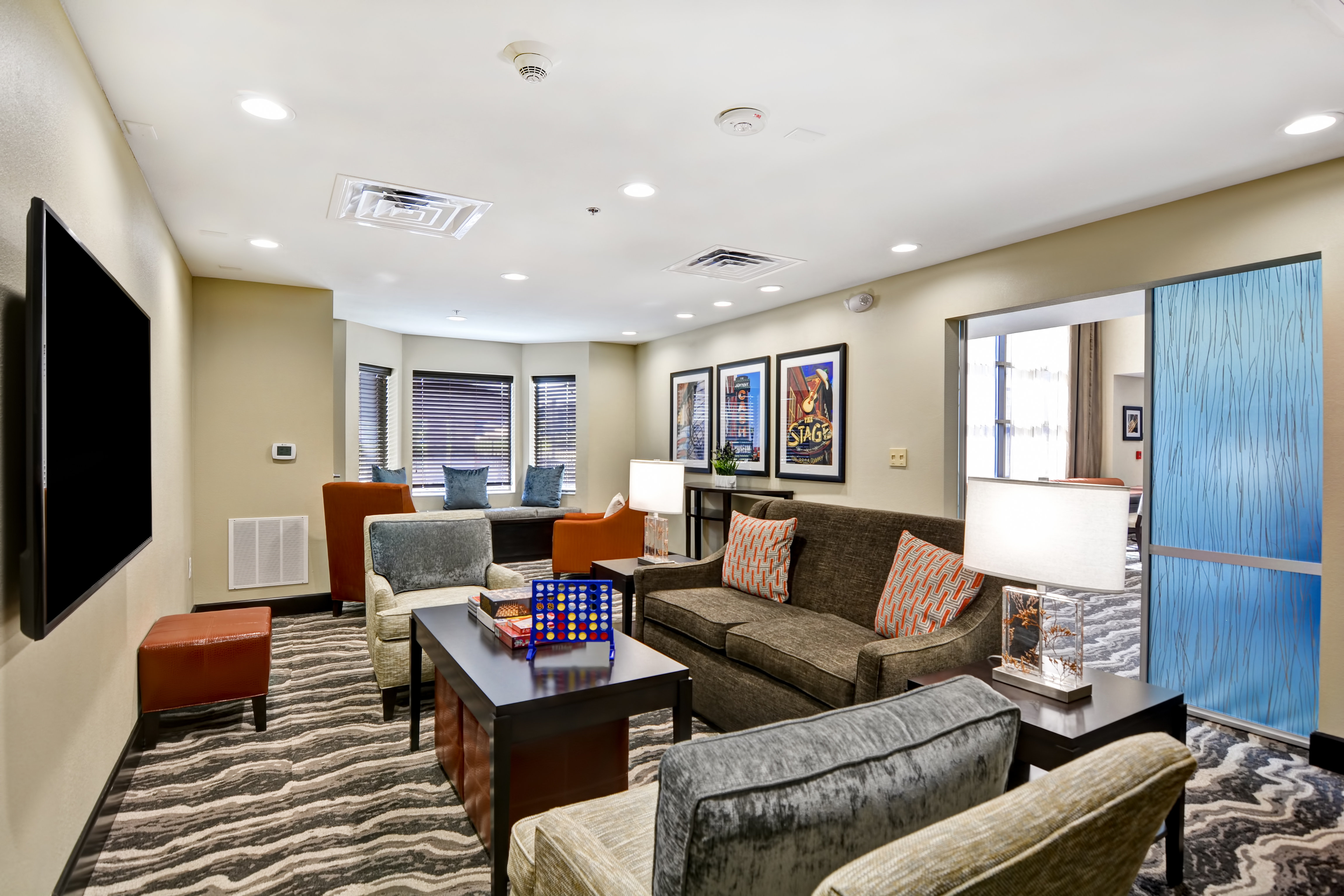 Relax & unwind in our Den at Staybridge Suites